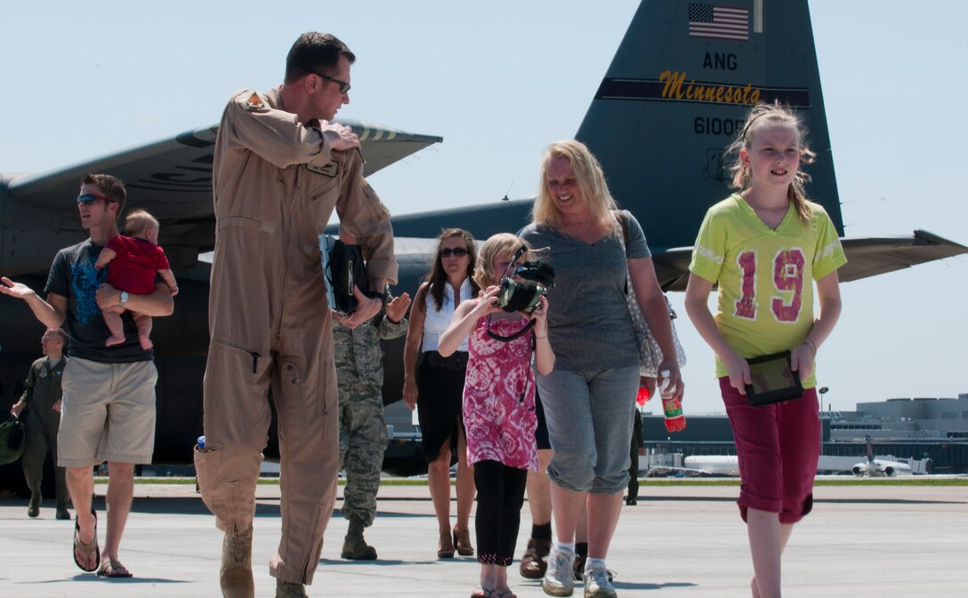 The last Minnesota Air National Guard C-130 “Hercules” from the current deployment arrived on July 16, 2012, bringing home about thirty Airmen from deployment to Southwest Asia to the St. Paul Air National Guard base, greeted by enthusiastic family and friends. Three C-130 flights, each with about thirty Airmen aboard, redeployed back to the 133rd Airlift Wing in July. USAF official photo by Tech. Sgt. Erik Gudmundson