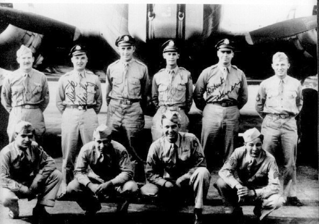 Second Lt. Donald R. Smith (back row, third from the left) poses with fellow crewmembers from the 303rd Bomb Group, 427th Bomb Squadron, in Sioux City, Iowa, May 1944. Smith was the co-pilot for 34 B-17 combat missions striking enemy targets in Germany and Czechoslovakia during his European tour in World War II. (Courtesy photo by Raymond T. Leal/Released)
