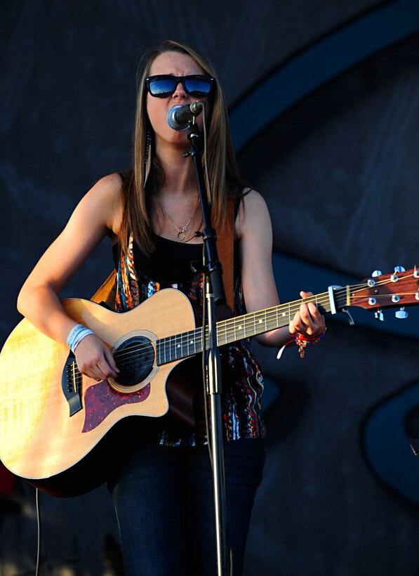 Bria Kelly, a 16-year-old musician, sings The Script's song "Breakeven,” as part of the opening act of the Sara Evans concert at Ft. Eustis, Va., July 13, 2012. The concert was a Morale, Welfare and Recreation event, and part of the Hampton Roads United Service Organization Military Concert Series. (U.S. Air Force photo by Staff Sgt. Ashley Hawkins/Released)