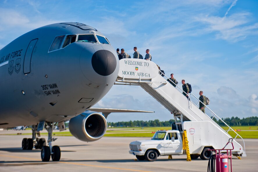 Airmen from the 23d Maintenance Group and 74th Fighter Squadron make their way to a KC-10 July 14, 2012, at Moody Air Force Base, Ga. The Airmen will support Red Flag 12-04, a three-week combat exercise involving air forces of the U.S. and its allies. (U.S. Air Force photo by Staff Sgt. Jamal D. Sutter/Released)  