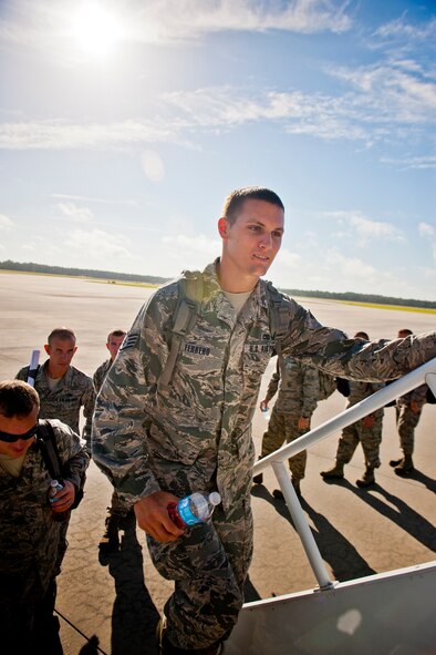 U.S. Air Force Staff Sgt. Dustin Ferrero, 23d Aircraft Maintenance Squadron, boards a KC-10 en route to Nellis Air Force Base, Nev., for exercise Red Flag July 14, 2012, at Moody Air Force Base, Ga. More than 120 Airmen departed Moody to participate in the three-week combat training exercise. (U.S. Air Force photo by Staff Sgt. Jamal D. Sutter/Released) 