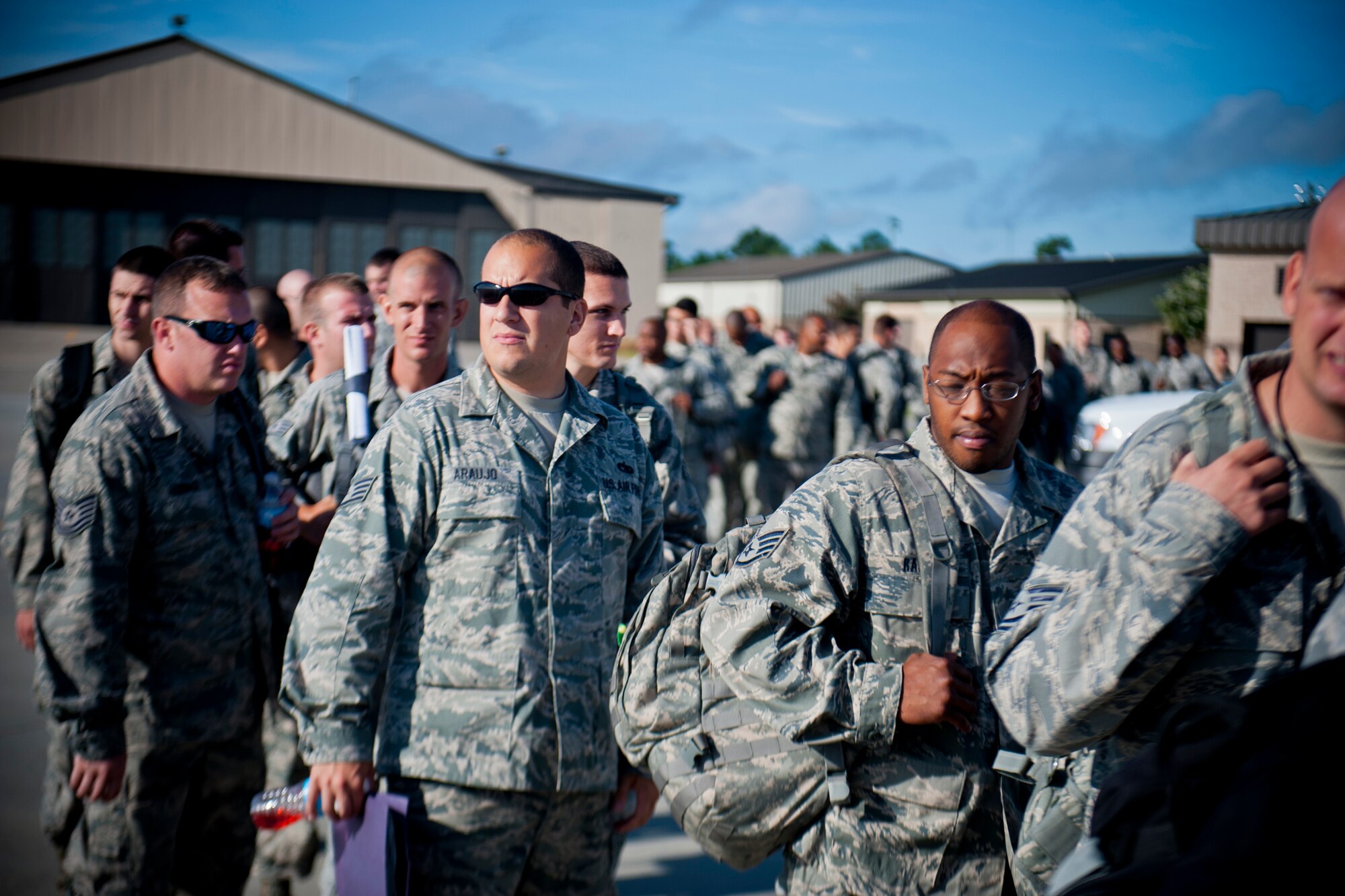 Airmen from the 23d Maintenance Group and 74th Fighter Squadron make their way to board a KC-10 en route to Nellis Air Force Base, Nev., for exercise Red Flag July 14, 2012, at Moody Air Force Base, Ga. Red Flag is conducted on the 15,000-square-mile Nevada Test and Training Range, north of Las Vegas, and will last approximately three weeks.  (U.S. Air Force photo by Staff Sgt. Jamal D. Sutter/Released) 
