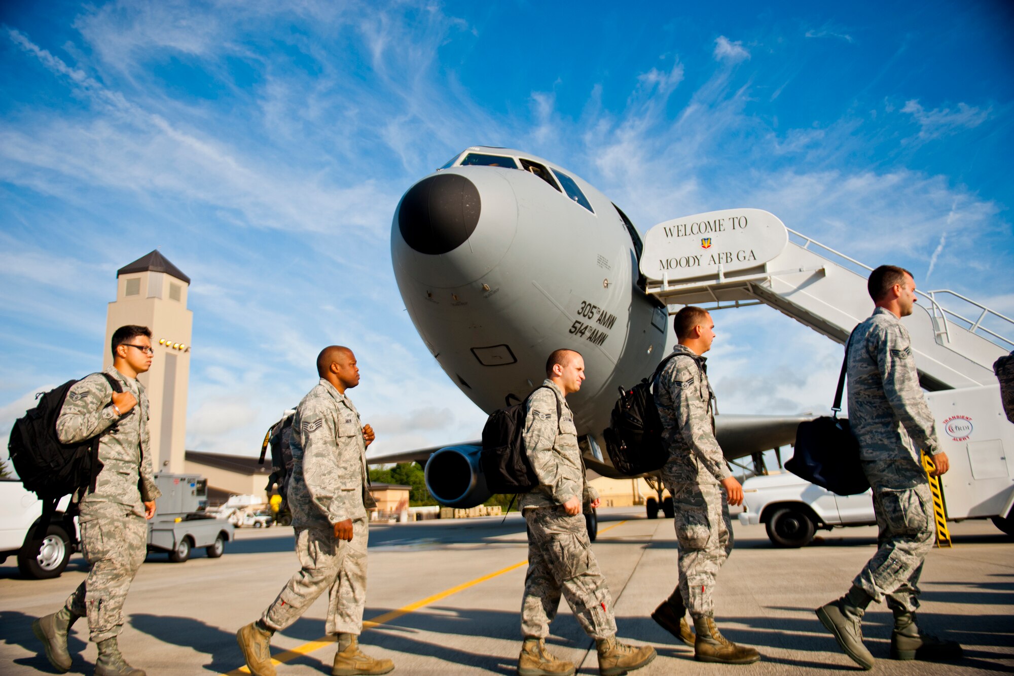 Airmen from the 23d Maintenance Group and 74th Fighter Squadron make their way to a KC-10 July 14, 2012, at Moody Air Force Base, Ga. The Airmen are supporting Red Flag, a realistic aerial combat training exercise hosted at Nellis Air Force Base, Nev. (U.S. Air Force photo by Staff Sgt. Jamal D. Sutter/Released)