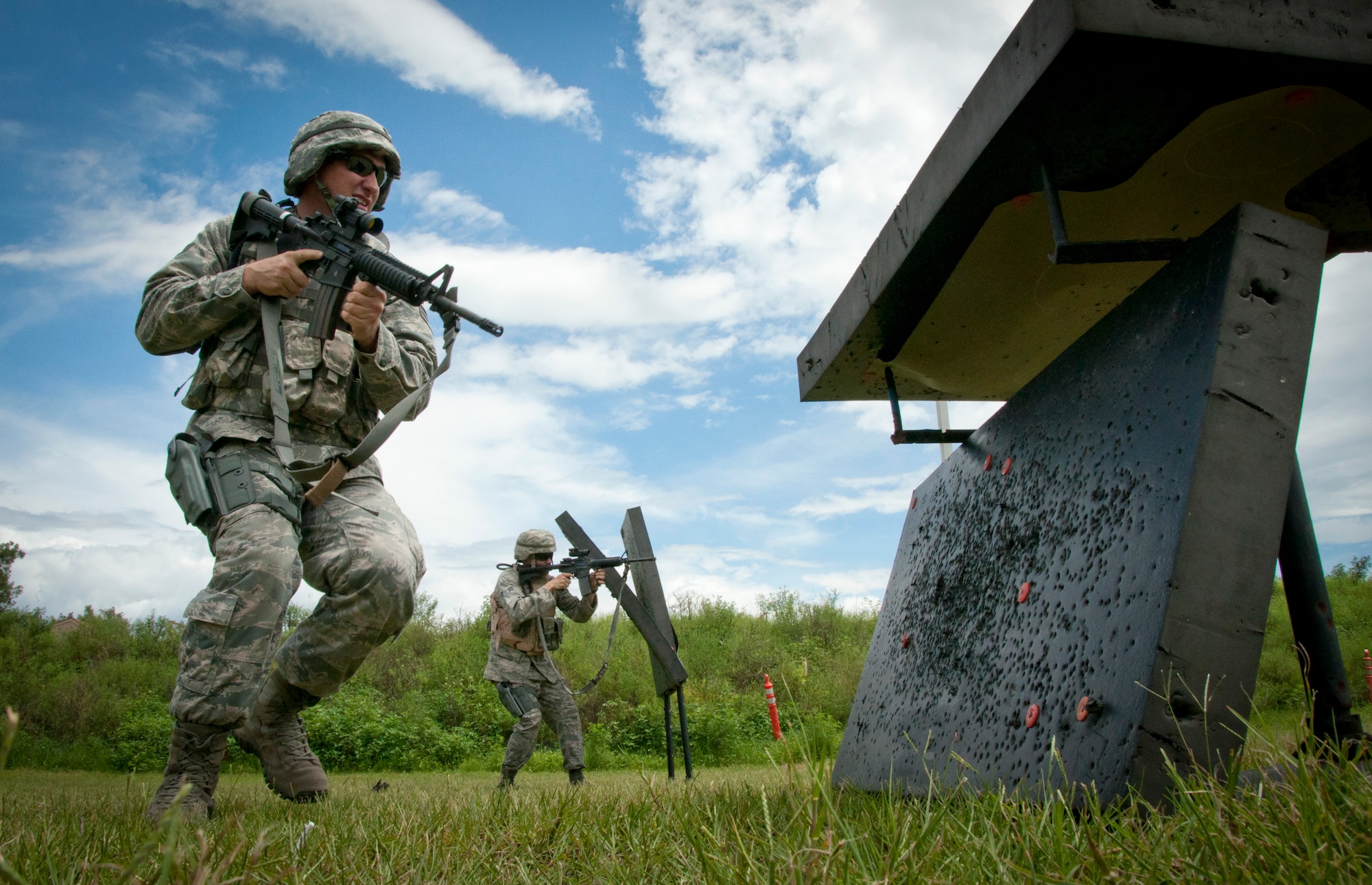 MACDILL AIR FORCE BASE, Fla. – Senior Airman Michael Shaw Spears, a fire team member with the 927th Security Forces Squadron here, prepares to lay down covering fire for his teammate behind him.  Shaw Spears and other members of the 927th SFS participated in the Shoot, Move, Communicate Course July 15, 2012.  The course taught them how to accurately engage targets while moving as a team and squad.  The training used FX DyMark rounds for safety purposes.  (Official U.S. Air Force photo/Staff Sgt. Shawn Rhodes)