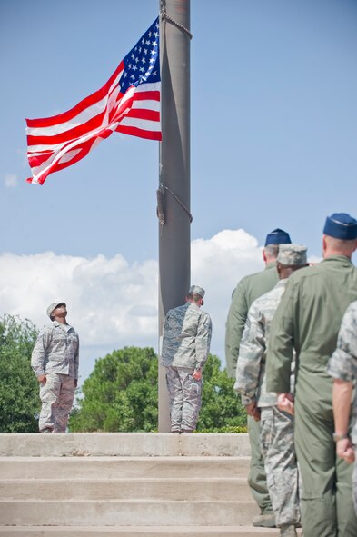 Dyess leadership render a salute as the American flag is lowered during a wing retreat ceremony July 13, 2012, at Dyess Air Force Base, Texas. A retreat ceremony signifies the end of a duty day and is also a way to pay tribute to the American flag. (U.S. Air Force photo by Airman 1st Class Jonathan Stefanko/ Released)