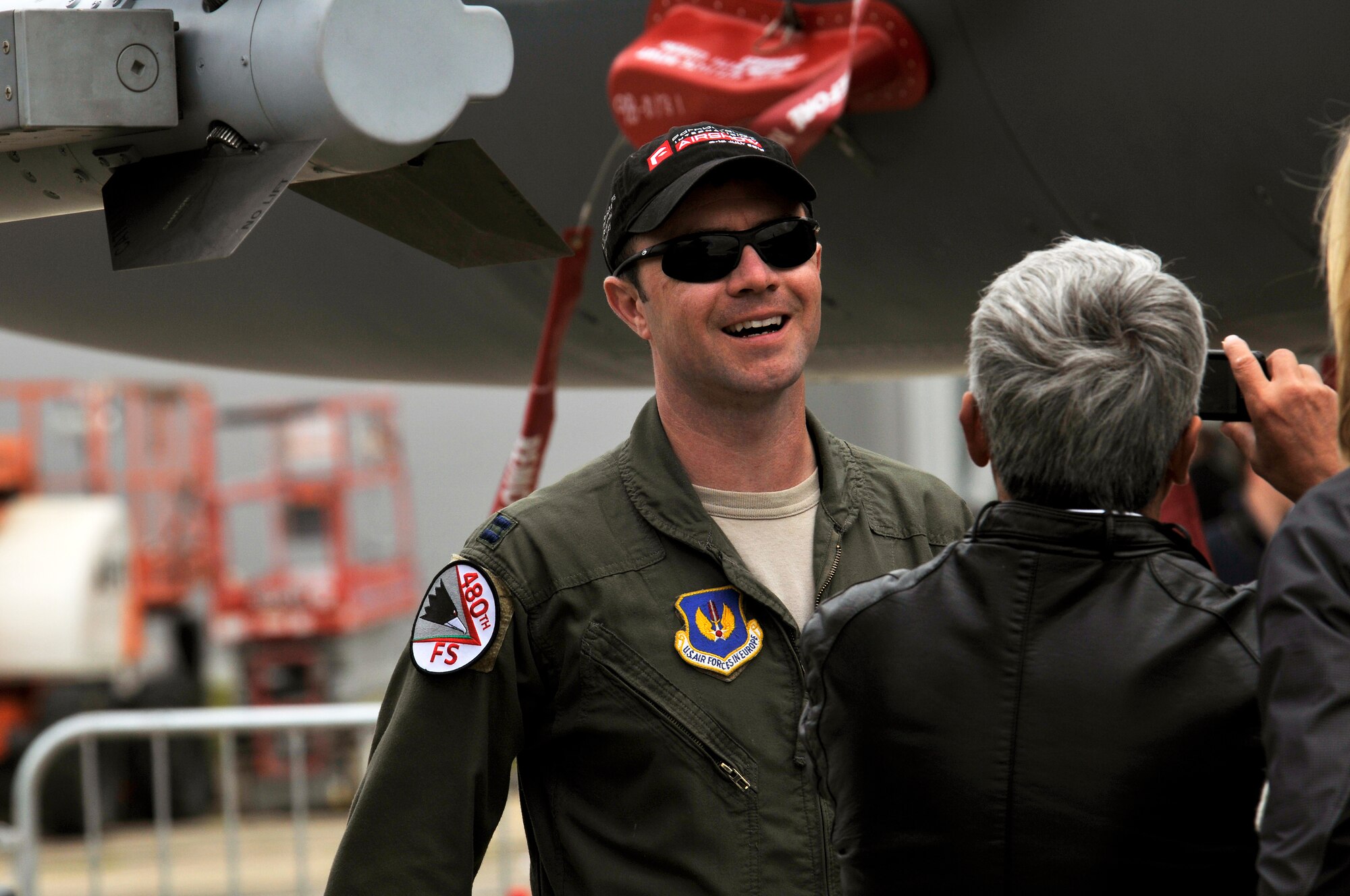 U.S. Air Force Capt. Jordan Hans, 480th Fighter Squadron pilot, shows the various weapons on an F-16 C Fighting Falcon to visitors, July 15, 2012, during the Farnborough International Air Show in Farnborough, England.  Approximately 90 aircrew and support personnel from bases in Europe and the United States are participating in the air show. More than 250,000 trade and public visitors attend the bi-annual event which concluded today.