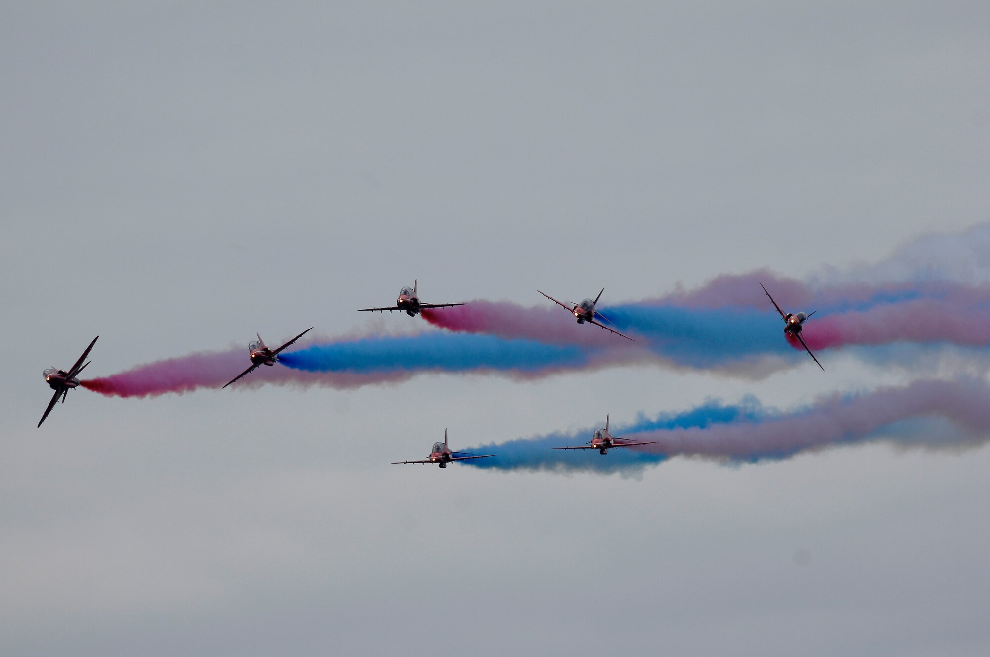The Royal Air Force Aerobatic Team 'Red Arrows' amaze thousands of spectators with an aerial demonstration, July 15, 2012, during the Farnborough International Air Show in Farnborough, England. More than 250,000 trade and public visitors attend the bi-annual event which concluded today.