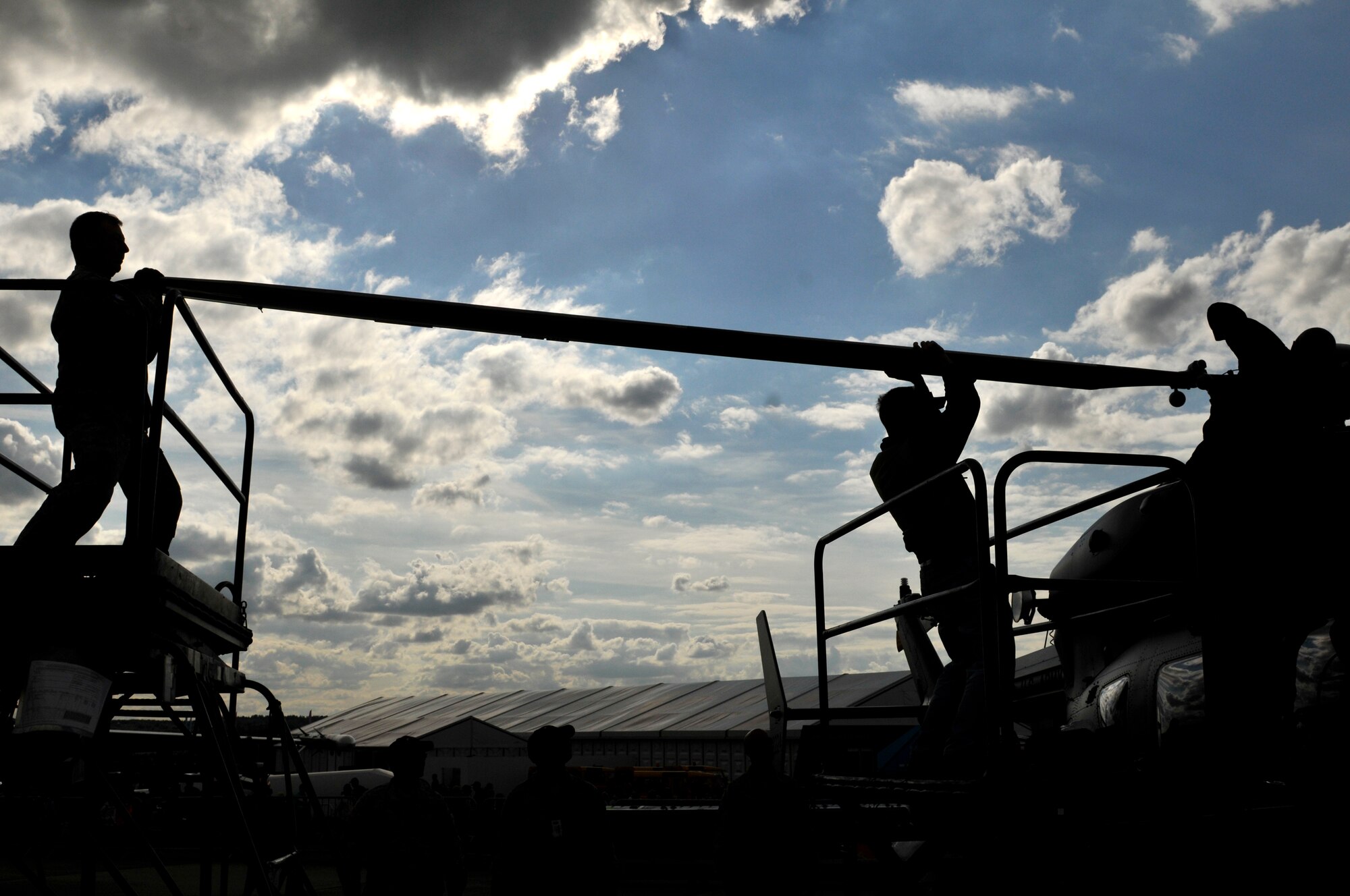 U.S. Air Force Airman 1st Class James Anderson and Airman 1st Class Christie Mitchell, 48th Security Forces Squadron response force members, patrol the U.S. military static display coral, July 10, 2012, during the Farnborough International Air Show in Farnborough, England. Approximately 90 aircrew and support personnel from bases in Europe and the United States are participating in the air show. Participation in this premier event demonstrates that U.S. defense industry offers state-of-the-art capabilities vital for the support and protection of our Allies' and Partners' national-security interests.