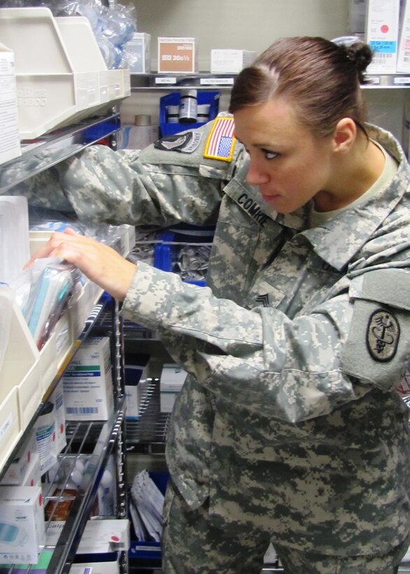 U.S. Army Sgt. Sara Comrie, the McDonald Army Health Center Troop 1 Medical Clinic noncommissioned officer-in-charge, sorts medical supplies at Fort Eustis, Va. recently. Comrie won the U.S. Medical Department Activity’s 2012 Noncommissioned Officer of the Year award. (U.S. Army photo by Marlon Martin/Released)