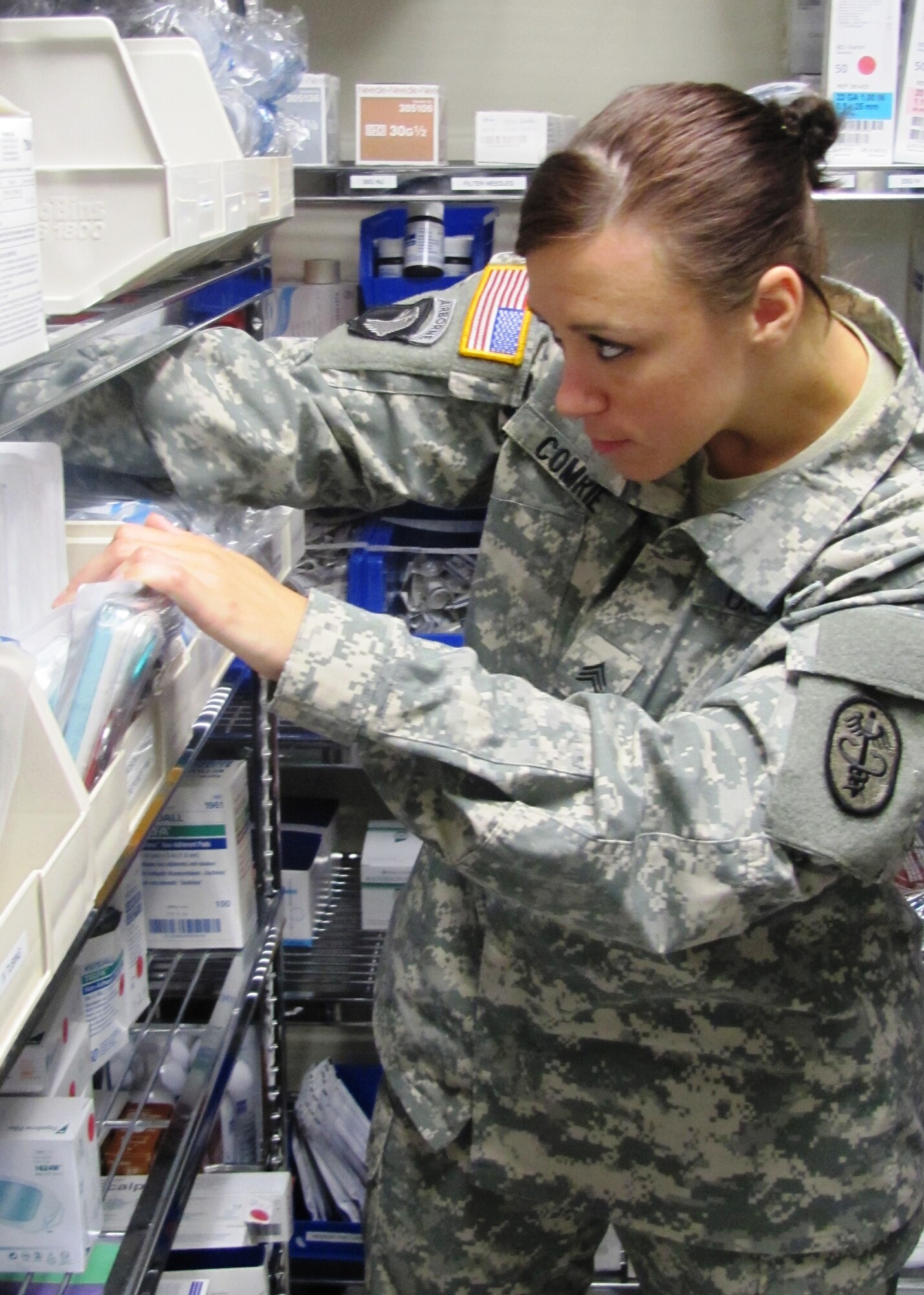 U.S. Army Sgt. Sara Comrie, the McDonald Army Health Center Troop 1 Medical Clinic noncommissioned officer-in-charge, sorts medical supplies at Fort Eustis, Va. recently. Comrie won the U.S. Medical Department Activity’s 2012 Noncommissioned Officer of the Year award. (U.S. Army photo by Marlon Martin/Released)