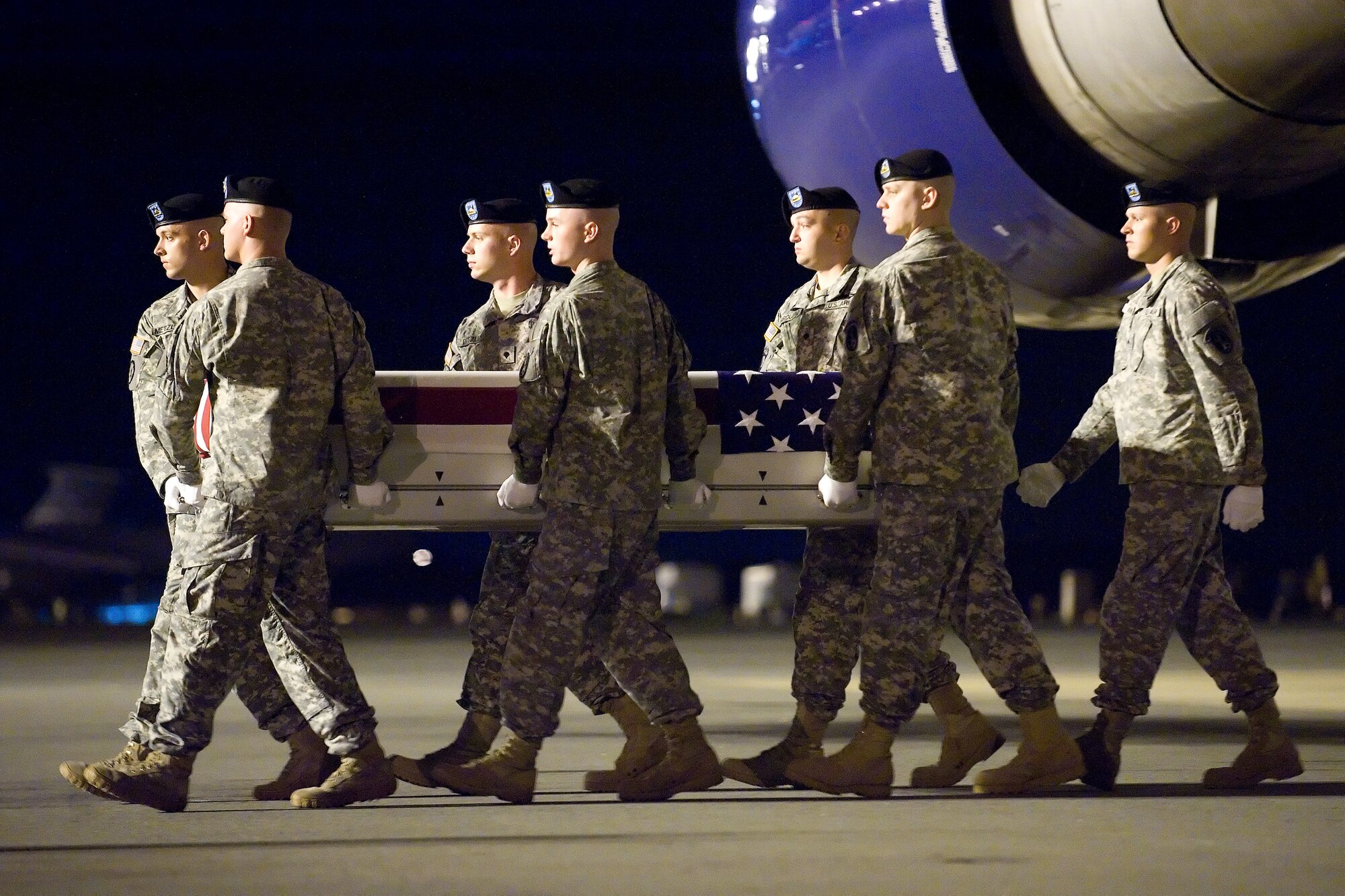 A U.S. Army carry team transfers the remains of Army Spc. Sterling W. Wyatt of Columbia, Mo., at Dover Air Force Base, Del., July 13, 2012. Wyatt was assigned to the 5th Battalion, 20th Infantry Regiment, 3rd Stryker Brigade Combat Team, 2nd Infantry Division, Joint Base Lewis-McChord, Wash. (U.S. Air Force photo/Adrian R. Rowan)