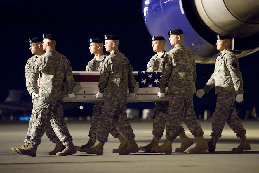 A U.S. Army carry team transfers the remains of Army Spc. Sterling W. Wyatt of Columbia, Mo., at Dover Air Force Base, Del., July 13, 2012. Wyatt was assigned to the 5th Battalion, 20th Infantry Regiment, 3rd Stryker Brigade Combat Team, 2nd Infantry Division, Joint Base Lewis-McChord, Wash. (U.S. Air Force photo/Adrian R. Rowan)
