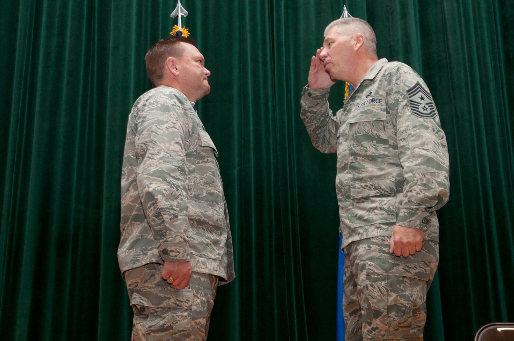 Chief Master Sgt. James Huffman salutes Col. Samuel C. Mahaney as he takes
the reigns as the new wing command chief, July 15, 2012. Chief Huffman assumed
responsibilities as command chief master sergeant after Chief Master Sgt.
Clifford Van Yahres retired. (U.S. Air Force photo/Tech. Sgt. Steve Lewis)
