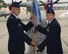 Col. Steven Parker, 340th Flying Training Group commander, passes the guidon to Lt. Col. Lee Morris as he accepts command of the 39th Flying Training Squadron in a ceremony at Randolph Air Force Base, Texas, June 29, 2012.  The 39 FTS, which falls under the 340th Flying Training Group at Randolph Air Force Base, Texas, supports Air Education and Training Command's Pilot Instructor Training mission (U.S. Air Force photo).