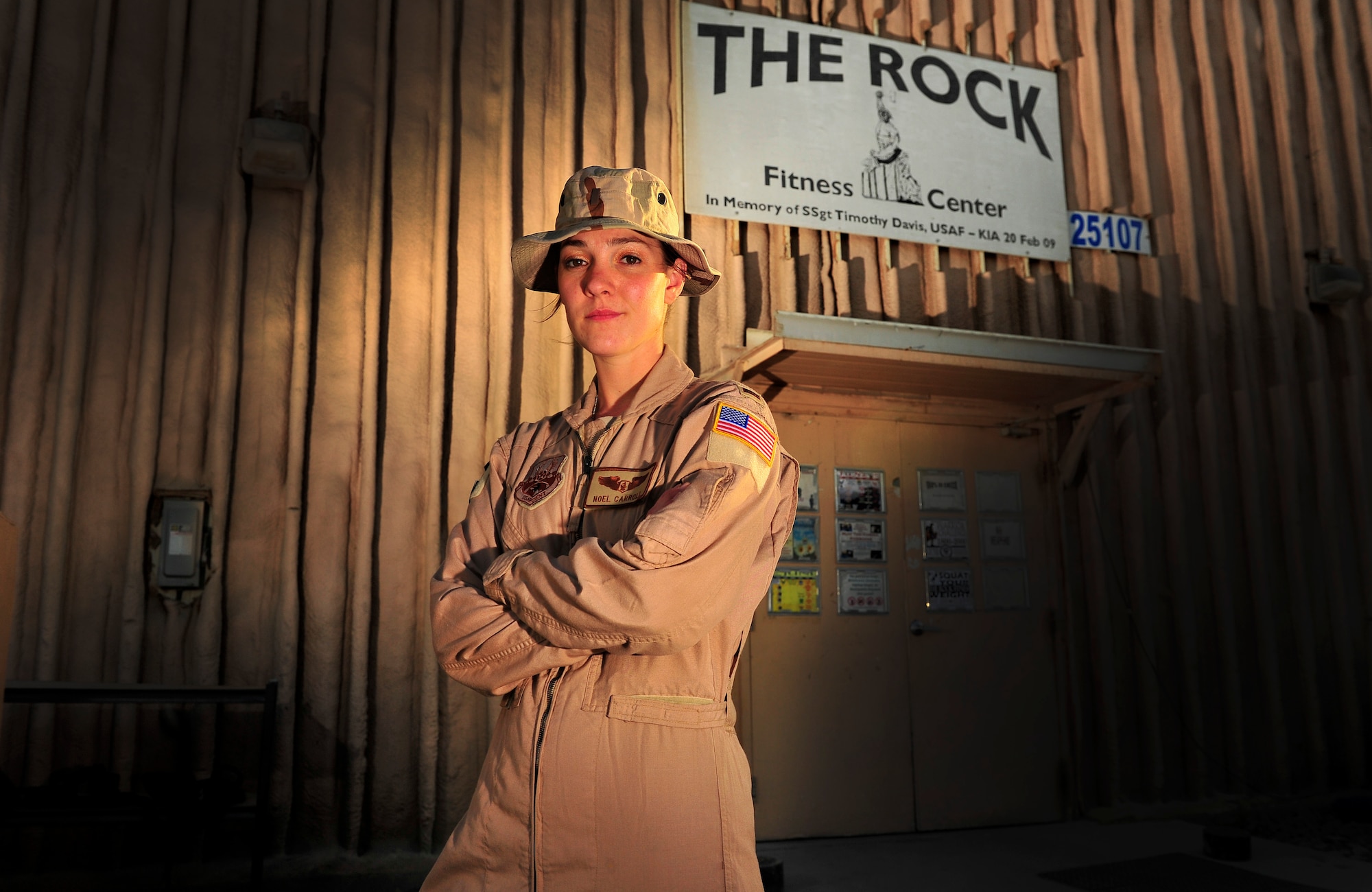 U.S. Air Force 2nd LT Noel Carroll, Flight Nurse, 455th Expeditionary Aeromedical Sq., has a morning routine of working out at a fitness center named after her brother, USAF SSgt Timothy Davis, Bagram Airfield, Afghanistan, May 31, 2012. The fitness center, called "The Rock", displays a memorial for her brother, who in 2009 was killed in action after an improvised explosive device (IED) struck his convoy. Davis was a Combat Controller.  

(U.S. Air Force photo/Staff Sgt. Clay Lancaster/Not Released)