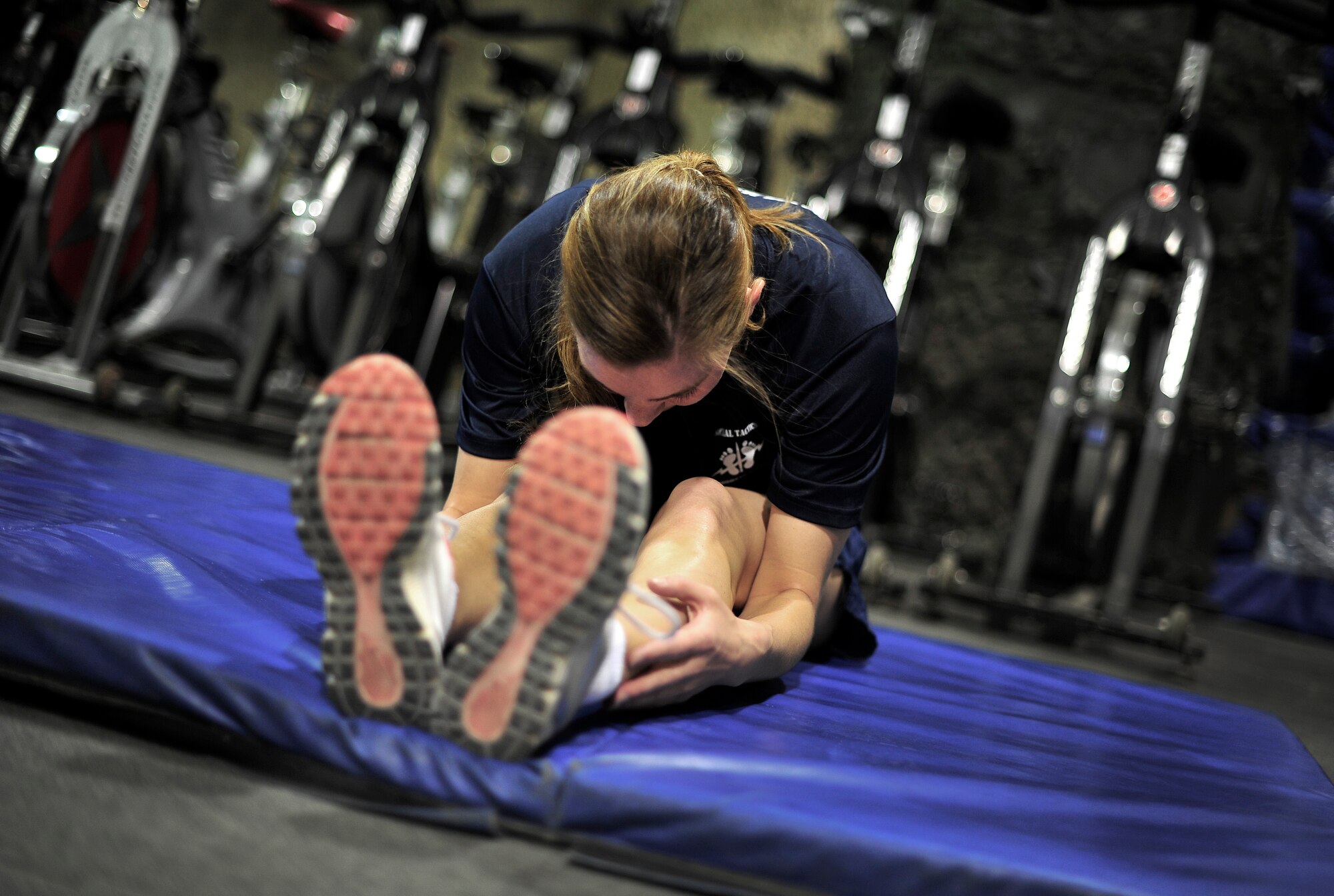 U.S. Air Force 2nd LT Noel Carroll, Flight Nurse, 455th Expeditionary Aeromedical Sq., works out at a fitness center named after her brother, USAF SSgt Timothy Davis, Bagram Airfield, Afghanistan, May 31, 2012. The fitness center, called "The Rock", displays a memorial for her brother, who in 2009 was killed in action after an improvised explosive device (IED) struck his convoy. Davis was a Combat Controller.  

(U.S. Air Force photo/Staff Sgt. Clay Lancaster/Not Released)