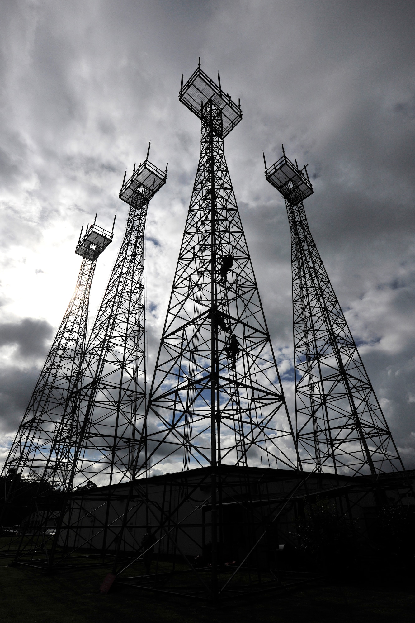 Staff Sgt. Michael Shoup, Senior Airman Nathan brooks, and Senior Airman Mayra Christian, 1st Communication Maintenance Squadron cable and antenna team, climb local antenna towers to conduct a safety climbing class on Ramstein Air Base, Germany,  July 11, 2012.  The 1st CMXS provides Tier II maintenance that installs, upgrades, removes and performs emergency repairs on antenna systems for 16 bases across the European theater.  (U.S. Air Force photo/Senior Airman Chris Willis)