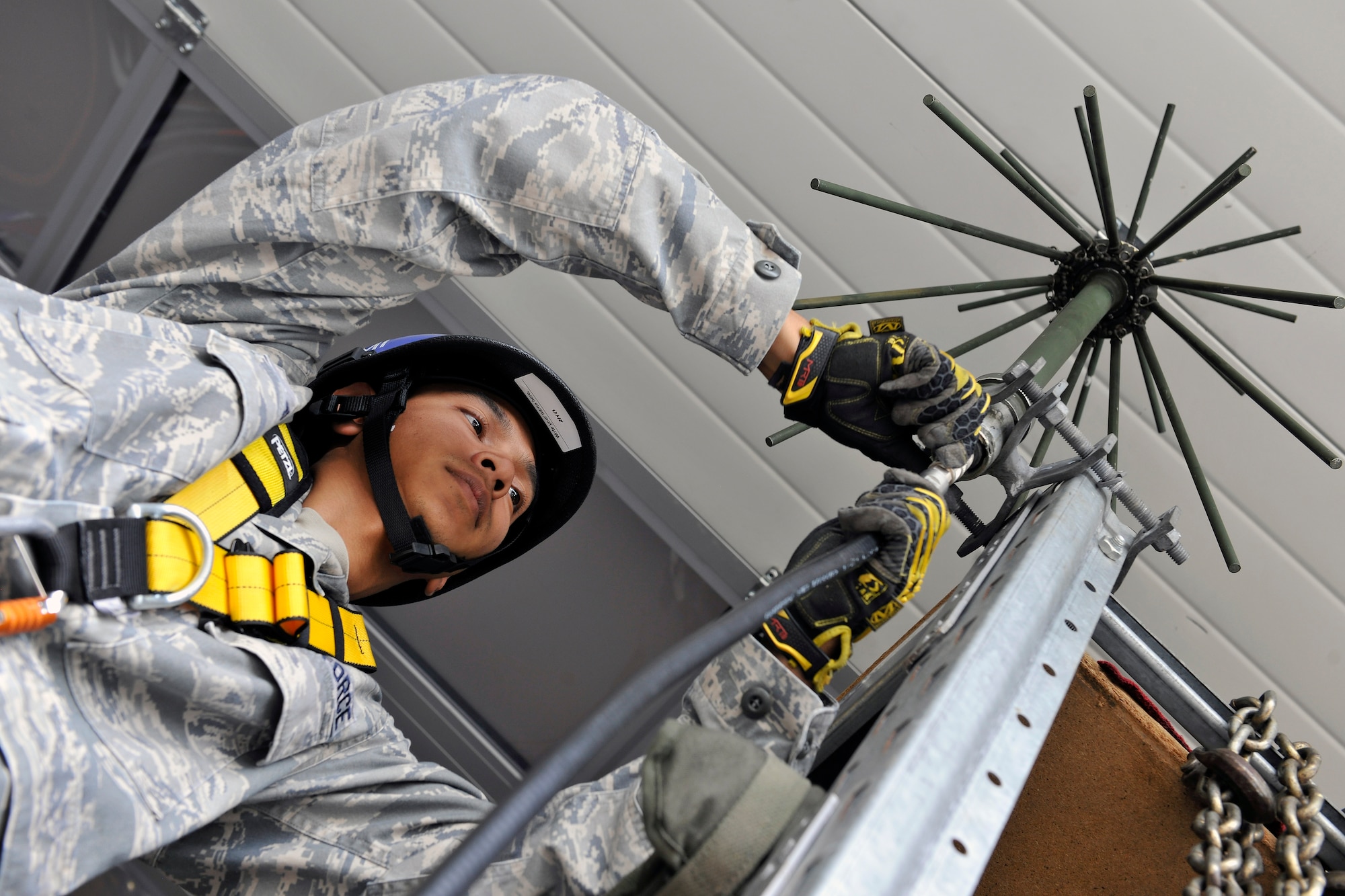 Senior Airman Roberto Reye, 1st Communication Maintenance Squadron cable and antenna team, performs a preventive maintenance inspection on a 197 antenna on Kapuan Air Station, Germany July 11, 2012. The 1st CMXS provides specialized communications maintenance support for cyberspace systems within the U.S. European Command and U.S. Africa Command areas of responsibility.  (U.S. Air Force photo/Senior Airman Chris Willis)