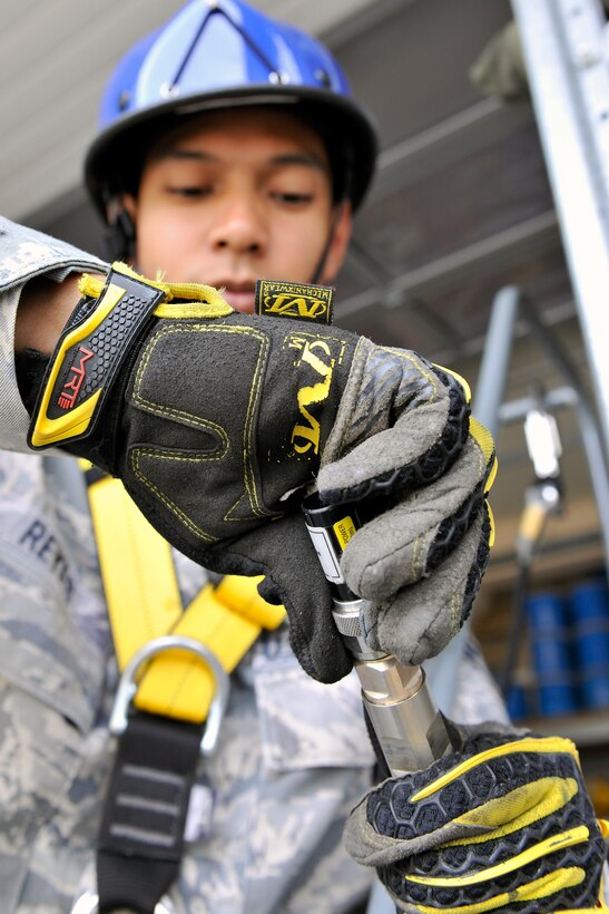 Senior Airman Roberto Reyes, 1st Communication Maintenance Squadron cable and antenna team, puts a load at the end of an antenna cable to test for any technical or mechanical problems on Kapuan Air Station, Germany July 11, 2012.  The 1st CMXS provides specialized communication maintenance support for cyberspace systems within the U.S. European Command and U.S. Africa Command areas of responsibility.  (U.S. Air Force photo/Senior Airman Chris Willis)