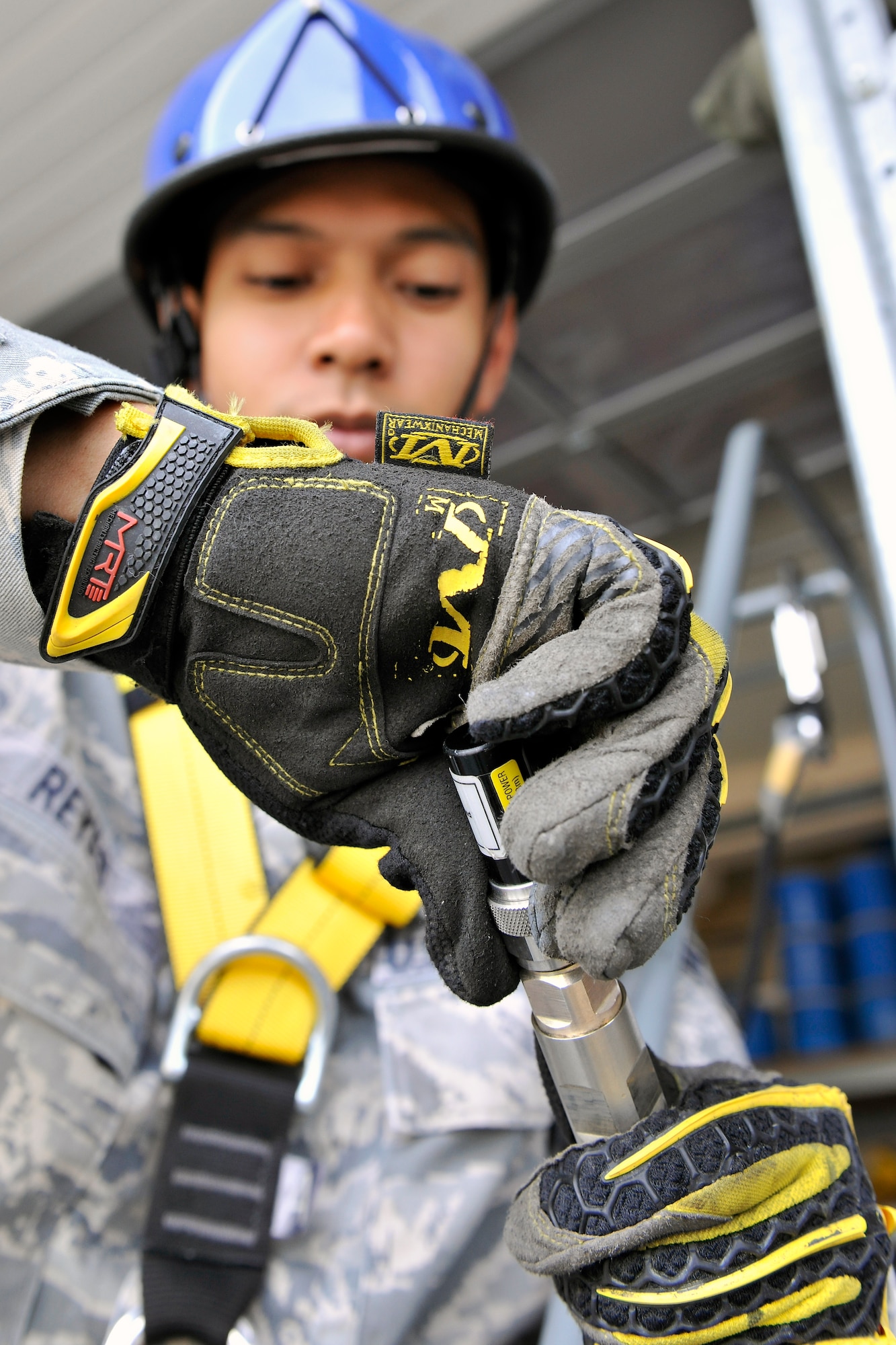 Senior Airman Roberto Reyes, 1st Communication Maintenance Squadron cable and antenna team, puts a load at the end of an antenna cable to test for any technical or mechanical problems on Kapuan Air Station, Germany July 11, 2012.  The 1st CMXS provides specialized communication maintenance support for cyberspace systems within the U.S. European Command and U.S. Africa Command areas of responsibility.  (U.S. Air Force photo/Senior Airman Chris Willis)