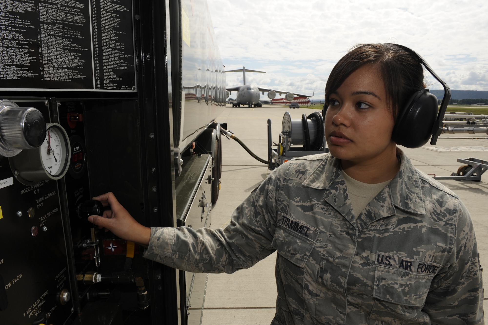 Senior Airman Janine Trammel, 86th Logistics Readiness Squadron fuels technician, checks a panel pressure display on Ramstein Air Base, Germany, July 10, 2012. Fuels help support this mission by continuously providing quality grade jet fuel. (U.S. Air Force photo/ Senior Airman Aaron-Forrest Wainwright)
