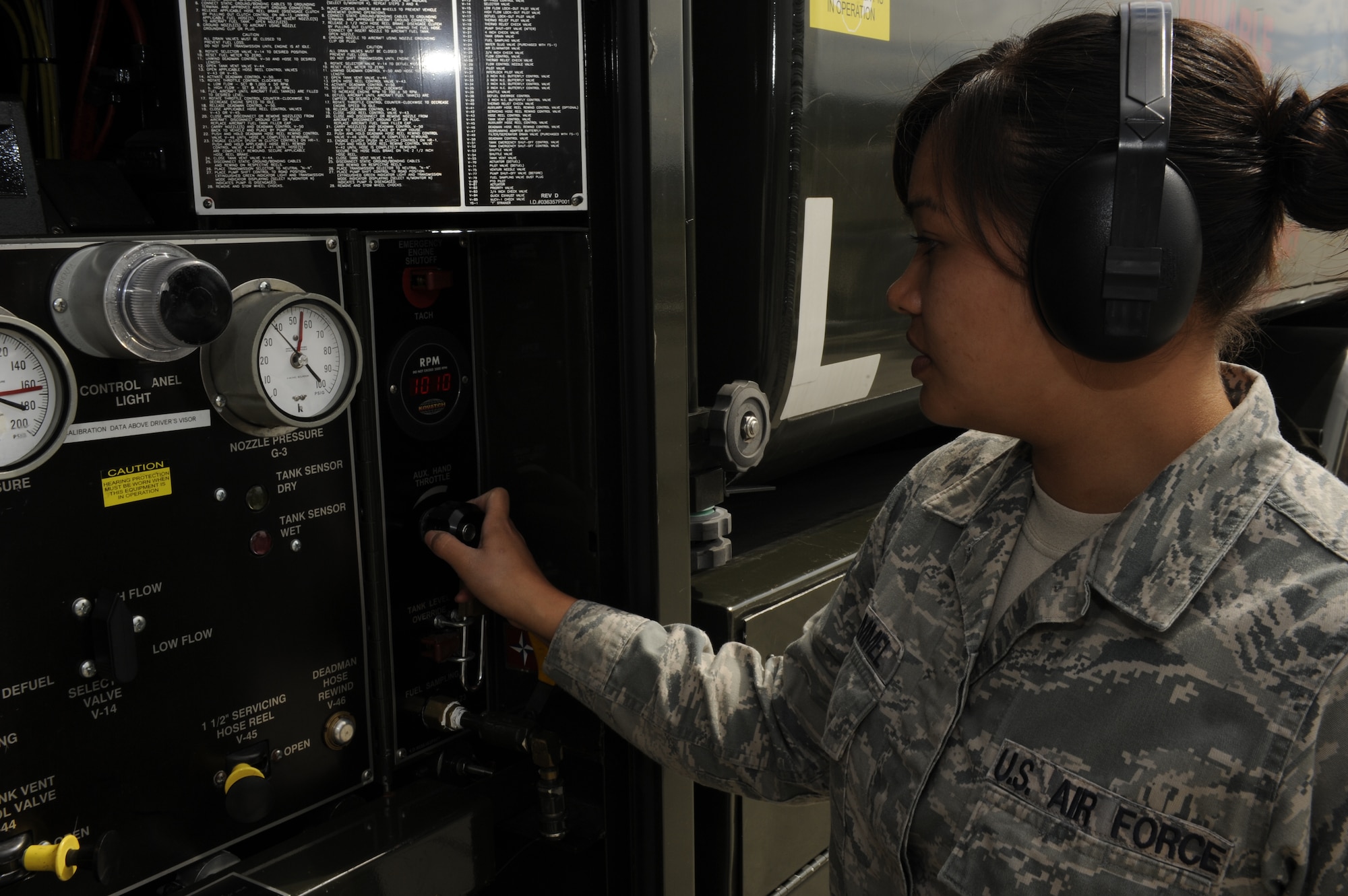 Senior Airman Janine Trammel, 86th Logistics Readiness Squadron, fuels technician, checks a panel pressure display on Ramstein Air Base, Germany, July 10, 2012. Fuels help support this mission by continuously providing quality grade jet fuel. (U.S. Air Force photo/ Senior Airman Aaron-Forrest Wainwright)