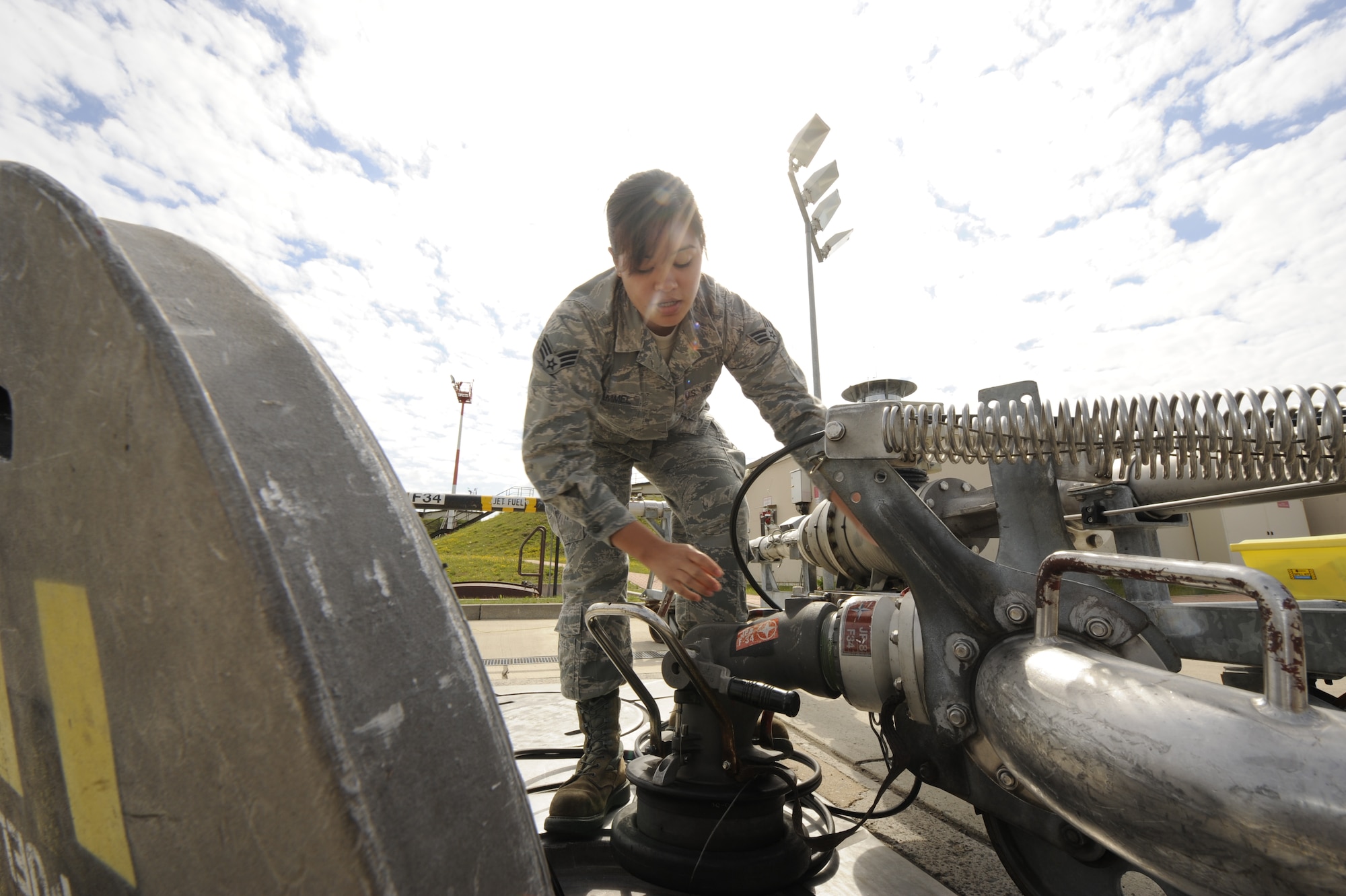 Senior Airman Janine Trammel 86th Logistics Readiness Squadron fuels technician, hooks up a moose head to a fuels pit to prepare for a refuel, on Ramstein Air Base, Germany, July 10, 2012. Fuels help support the mission by continuously providing quality grade jet fuel. (U.S. Air Force photo/ Senior Airman Aaron-Forrest Wainwright)