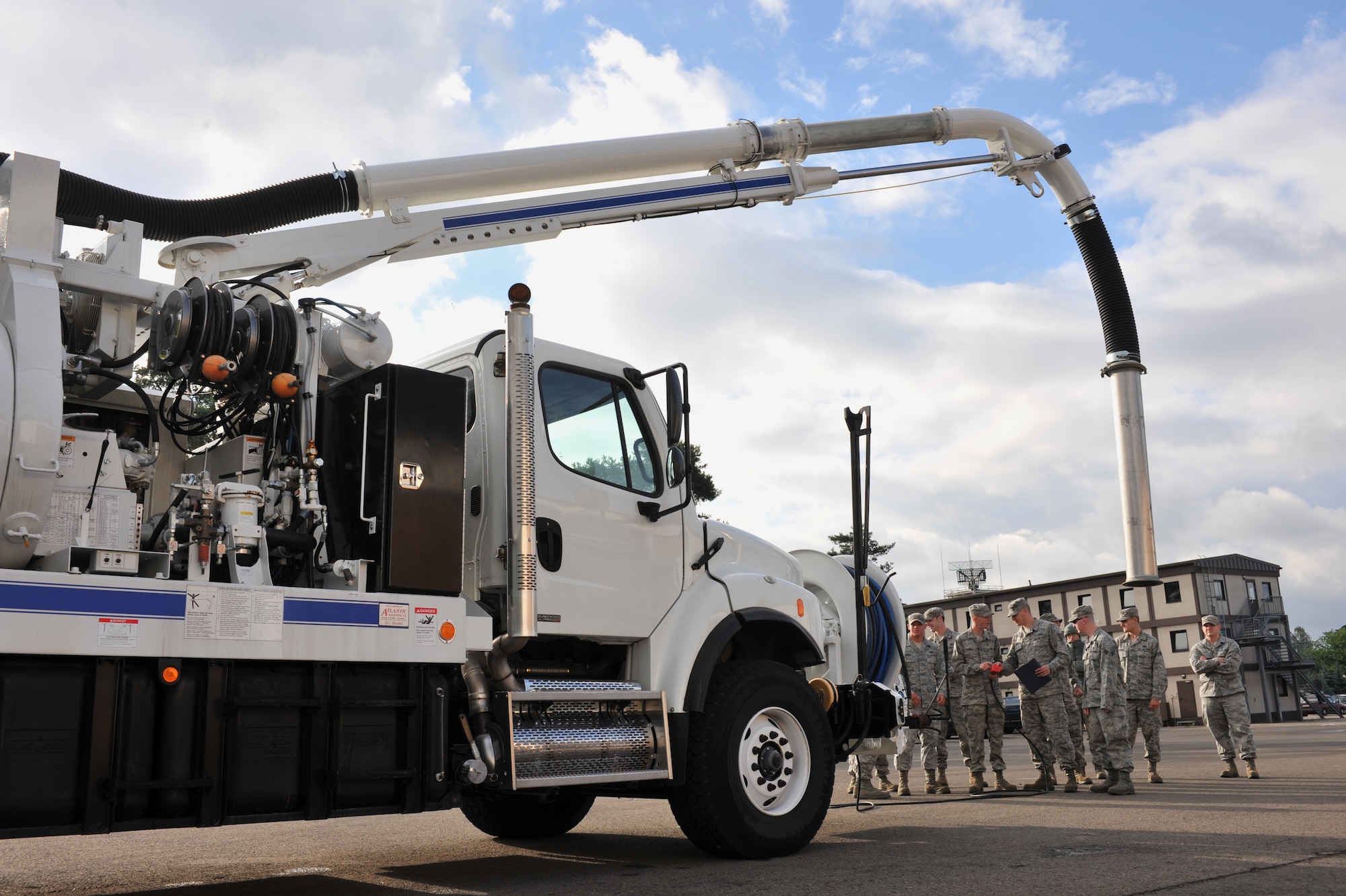 Members of the 786th Civil Engineer Squadron receive training on a sewer truck’s operations during their monthly Prime Base Engineer Emergency Force training day, Ramstein Air Base, Germany, July 12, 2012.  The 86th CEG provide, maintain and protect real property assigned to the 86th Airlift Wing, the Kaiserslautern Military Community and associated units while supporting worldwide contingencies with trained combat engineers and equipment. (U.S. Air Force photo/Senior Airman Caitlin O'Neil-McKeown)