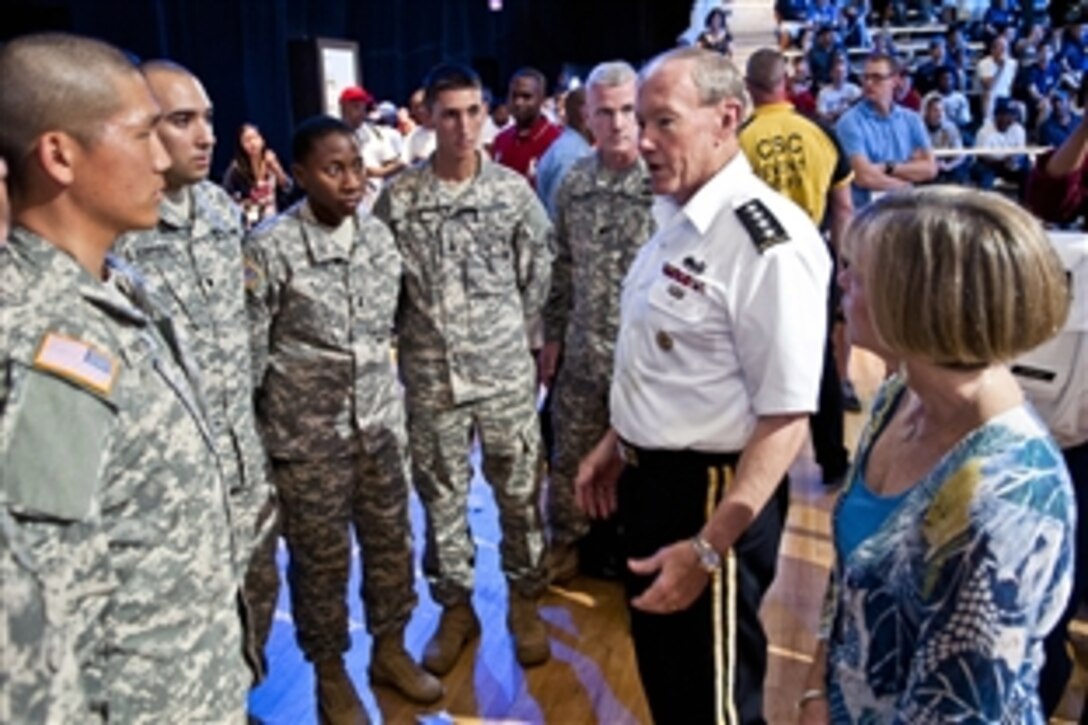 Army Gen. Martin E. Dempsey, chairman of the Joint Chiefs of Staff, speaks with service members who were in attendance to watch the Men's Olympic basketball team scrimmage and practice at the District of Columbia National Guard Armory in Washington, D.C., July 14, 2012.