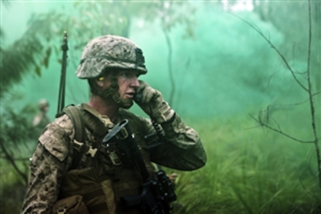 U.S. Marine Corps Staff Sgt. Bryan Robbins calls for mortar support during a live-fire exercise on Shoalwater Bay Training Area, Queensland, Australia, July 13, 2012. Robbins is a platoon sergeant assigned to 3rd Platoon, Company G., Battalion Landing Team 2nd Battalion, 1st Marines, 31st Marine Expeditionary Unit. Exercise Hamel 2012 is a multi-national training evolution between the U.S. Marine Corps, Australian Army and New Zealand Army, aimed at certifying the Australian 1st Brigade for oper