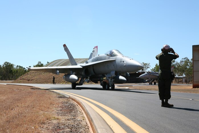 Capt. Timothy J. Farag, Marine Fighter Attack Squadron 232 logistics officer and F/A-18 pilot, approaches the runway before conducting flight training here July 16 as part of Southern Frontier 2012. SF12 is an annual, unilateral training exercise hosted by the Royal Australian Air Force allowing Marine Aircraft Group 12 F/A-18 squadrons the opportunity to focus on Offensive Air Support training in order to improve squadron readiness.