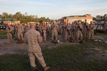 Marines with Marine Wing Support Squadron 272 get briefed prior to their departure to Marine Corps Air Ground Combat Center Twentynine Palms, Calif., for Enhanced Mojave Viper training, July 13. 