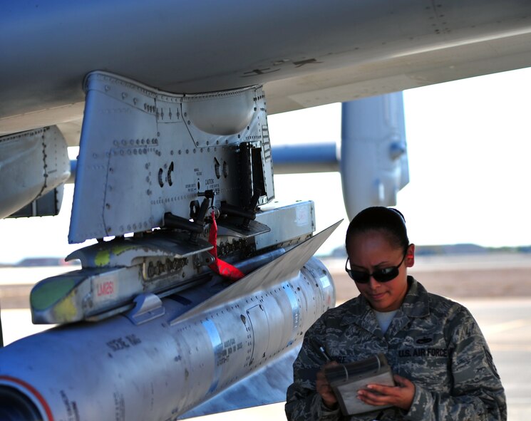 U.S. Air Force Staff Sgt. Eleanor Moore, 23d Aircraft Maintenance Squadron, 74th Aircraft Maintenance Unit weapons armament systems specialist, reviews her checklist before removing munitions off an A-10C Thunderbolt II during Red Flag 12-4 at Nellis Air Force Base, Nev., July 16, 2012. Following proper procedures and safely working with a sense of urgency increases efficiency in loading munitions onto the aircraft, which is vital to the A-10 mission.  (U.S. Air Force photo by Staff Sgt. Stephanie Mancha/Released)