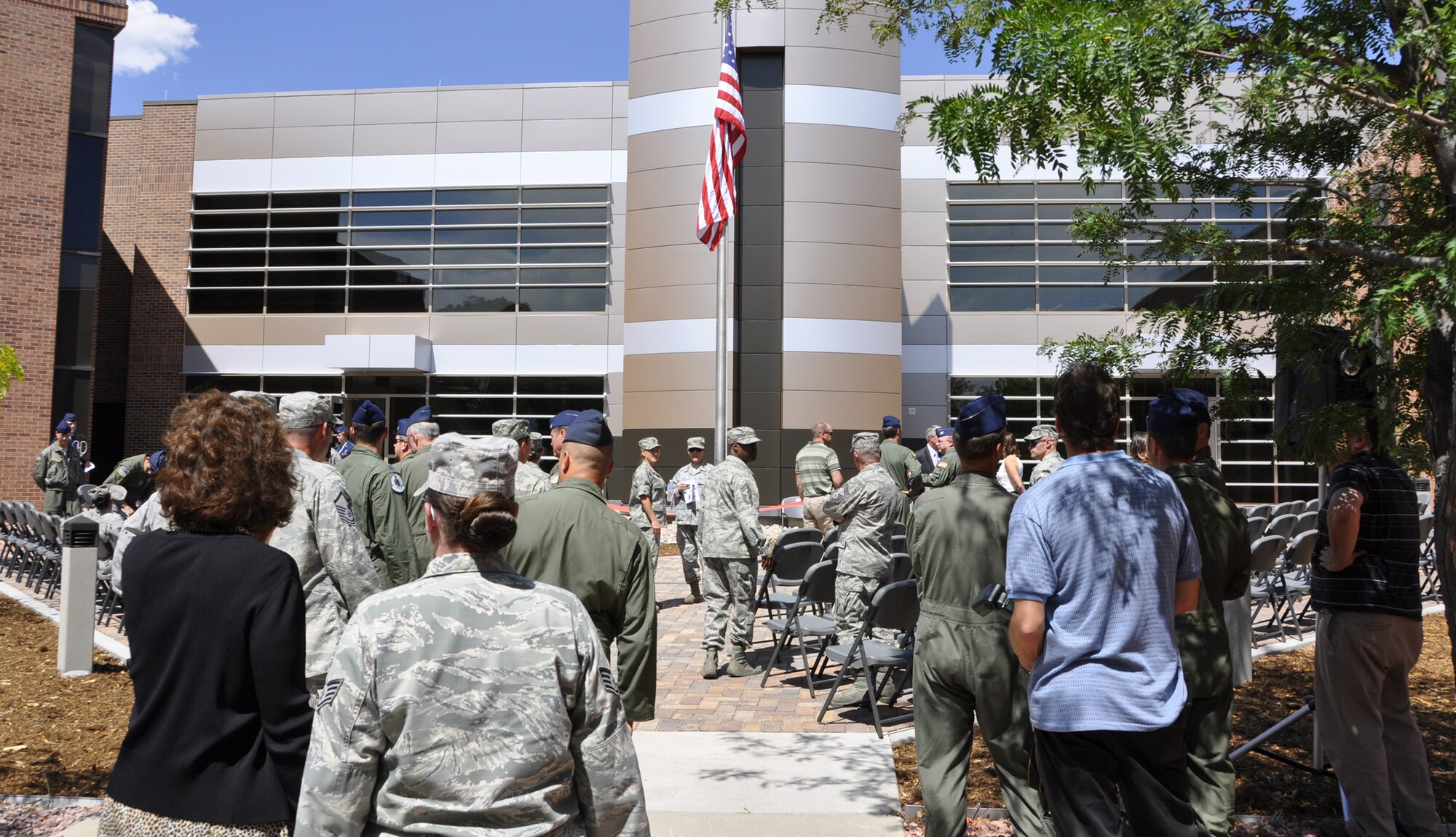 Members of the 302nd Airlift Wing, 19th Airlift Wing and civic leaders from
both Colorado Springs, Colo., and Little Rock, Ark., gather in the courtyard
of the Total Force Integration campus July 17 at Peterson Air Force Base,
Colo. Soon after, leadership from both the 302nd AW and 19th AW participated
in a ribbon cutting ceremony to officially dedicate the newest building that
will be home to the Active Duty 52nd Airlift Squadron and the Air Force
Reserve's 731st Airlift Squadron. The 52nd AS, assigned to the 19th AW based
at Little Rock AFB, Ark., associated with the AF Reserve's 302nd AW in
October 2009. (U.S. Air Force photo/Tech. Sgt. Daniel Butterfield)