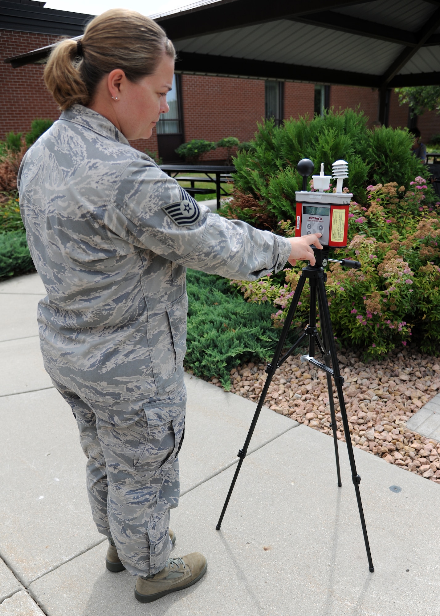 Tech. Sgt. Jennifer Kingsley, 319th Medical Operations Squadron, checks the
wet bulb globe temperature device, on July 16, 2012, on Grand Forks Air
Force Base, N.D. The WBGT device measures humidity, radiant heat and dry
heat. (Air Force photo/Airman 1st Class Ashley N. Taylor)
