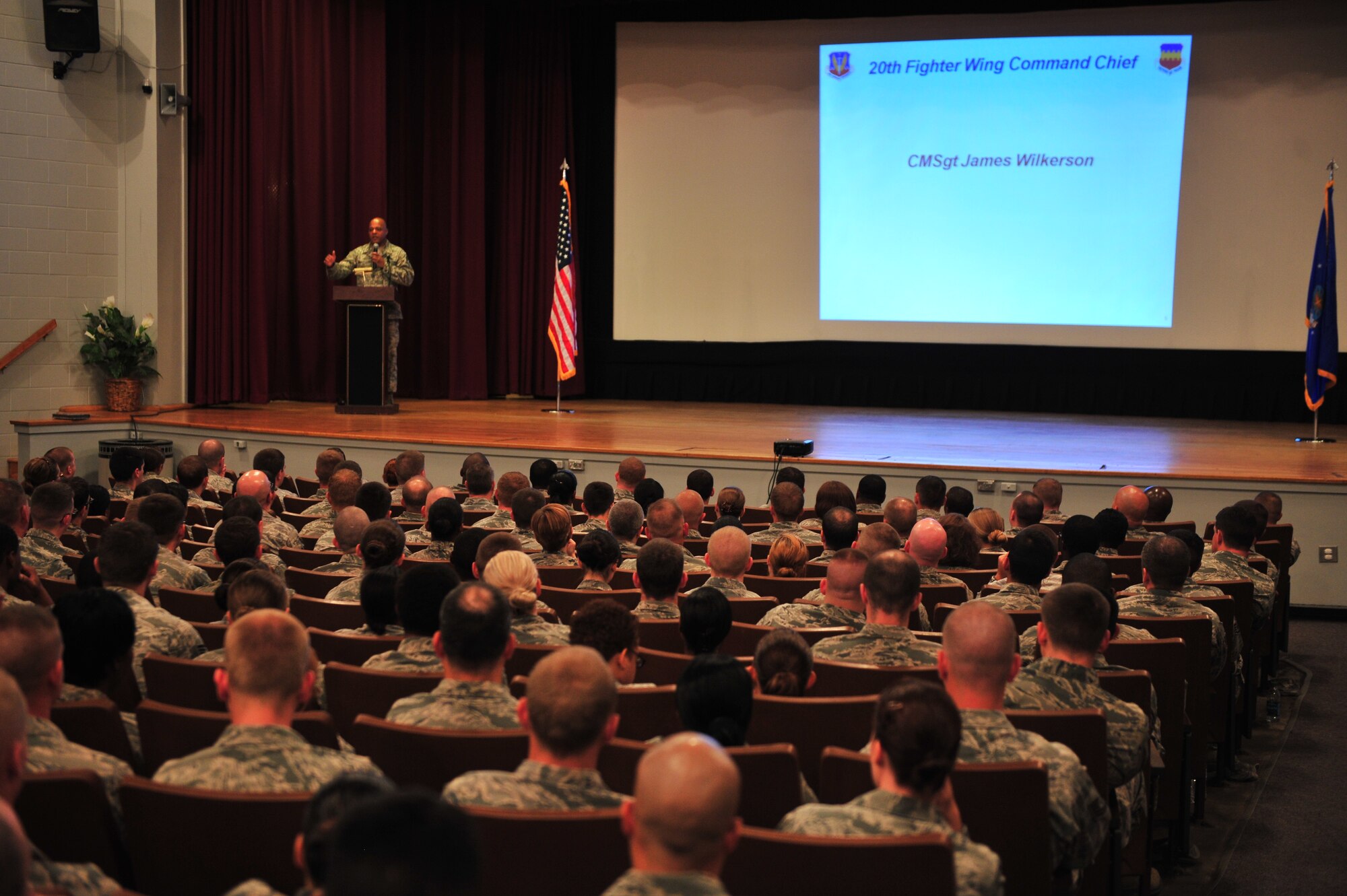 Chief Master Sgt. James Wilkerson, 20th Fighter Wing command chief, speaks to the wing’s Airmen at Shaw Air Force Base, S.C., July 13, 2012. Wilkerson held the enlisted call to present the enlisted perspective of the 20th FW Commander’s message and intent. He also took the time to listen to feedback and answered questions from the Airmen. (U.S. Air Force photo by Krystal M. Jeffers/Released)