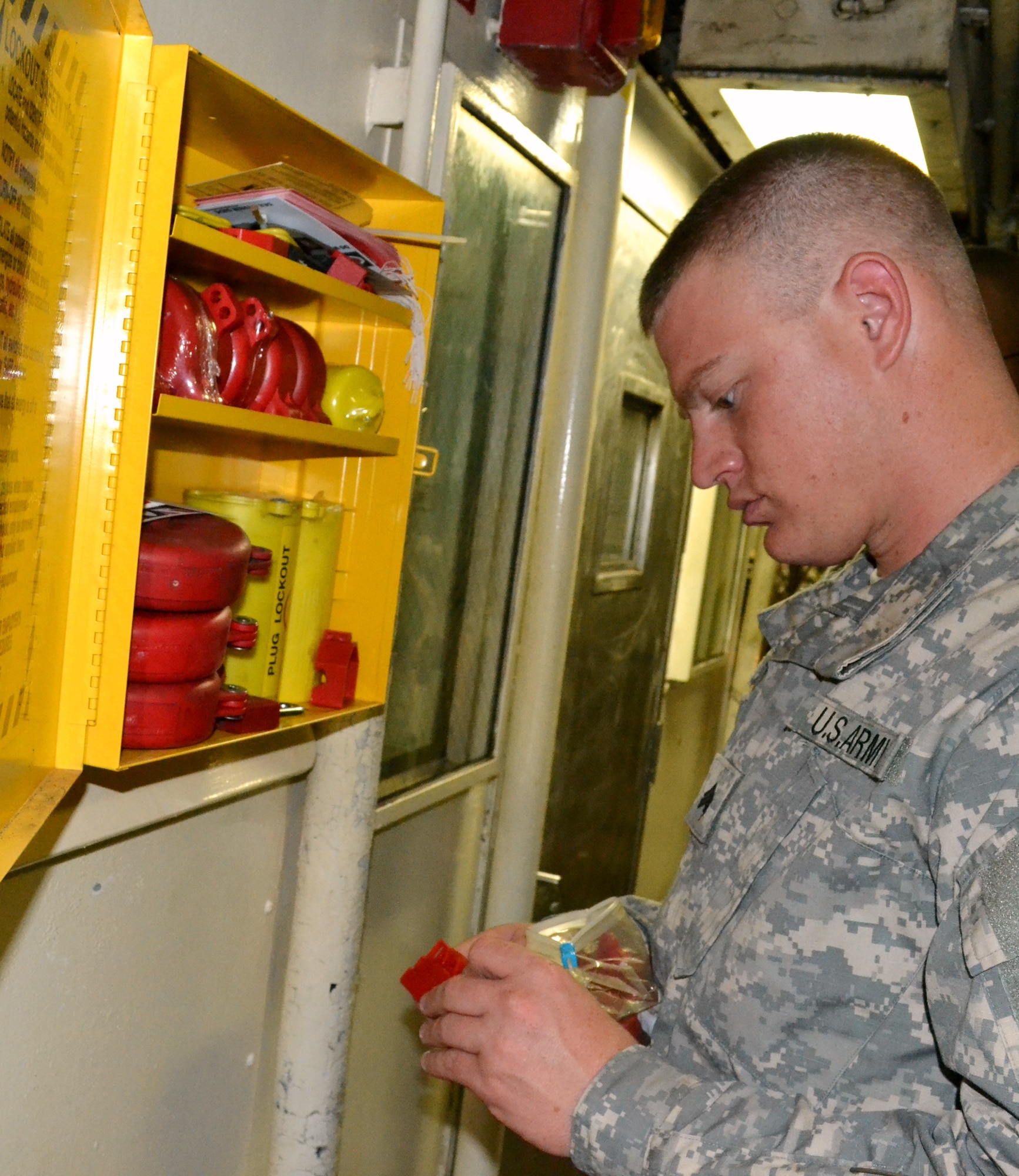 U. S. Army Sgt. Justin Kaplan, senior watercraft engineman on the U.S. Army Vessel Landing Craft Utility 2023, inspect some of the safety equipment in the lower deck of the 'Hobkirk' during a maintenance inspection June 22. Kaplan is responsible for the maintenance of the electrical equipment, engine, fuel, water pipes, and other maintenance needs on the boat. (U.S. Army photo by Sgt. Edwin J. Rodriguez/Released)