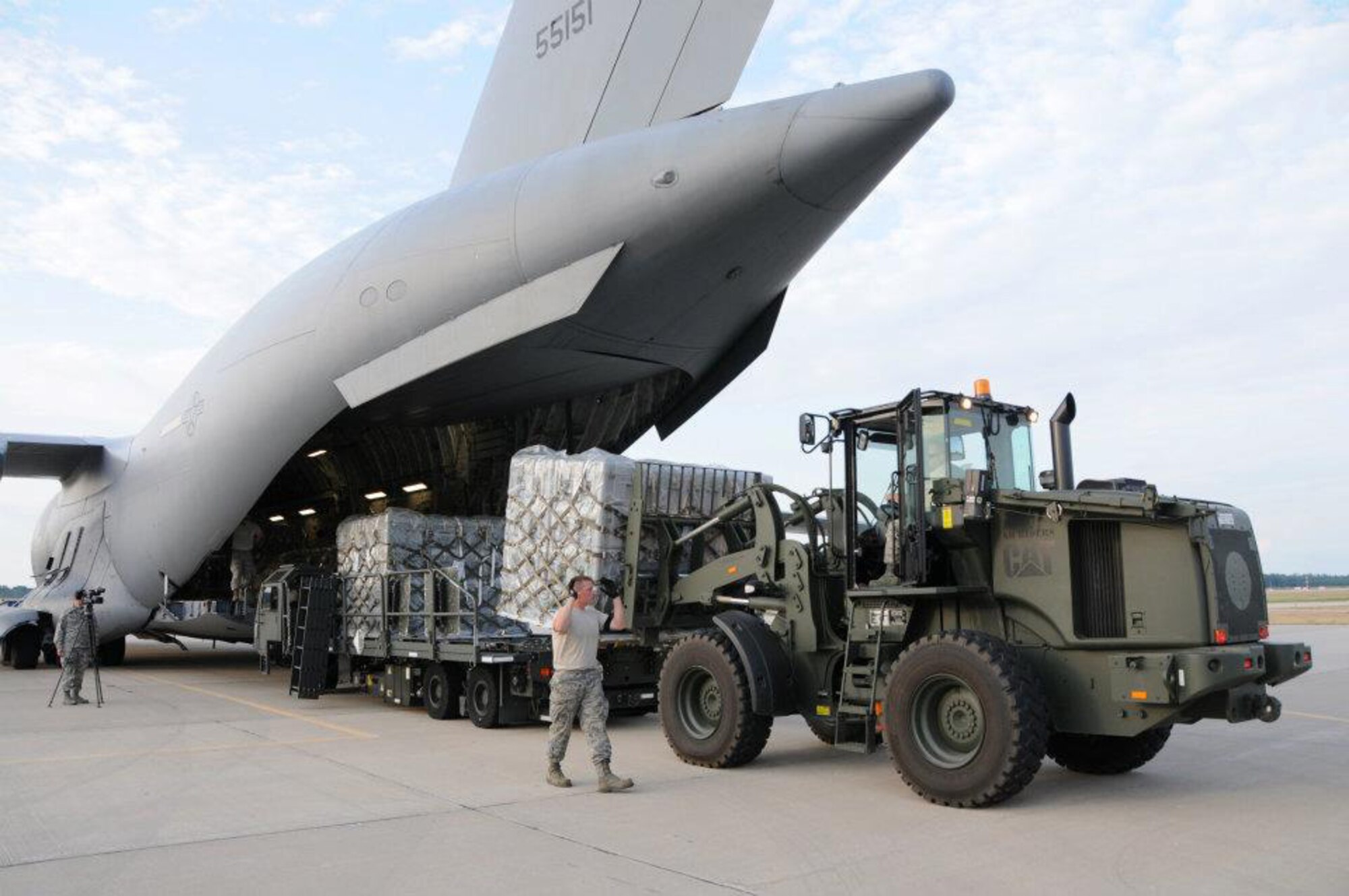 Air National Guard members remove equipment from a C-17 Globemaster III in support of PATRIOT 12 Exercise. PATRIOT 12 held at Volk Field, Wis. is used to sharpen the skills of emergency responders. (National Guard photo by Master Sgt. Ralph J. Kapustka/Released)
