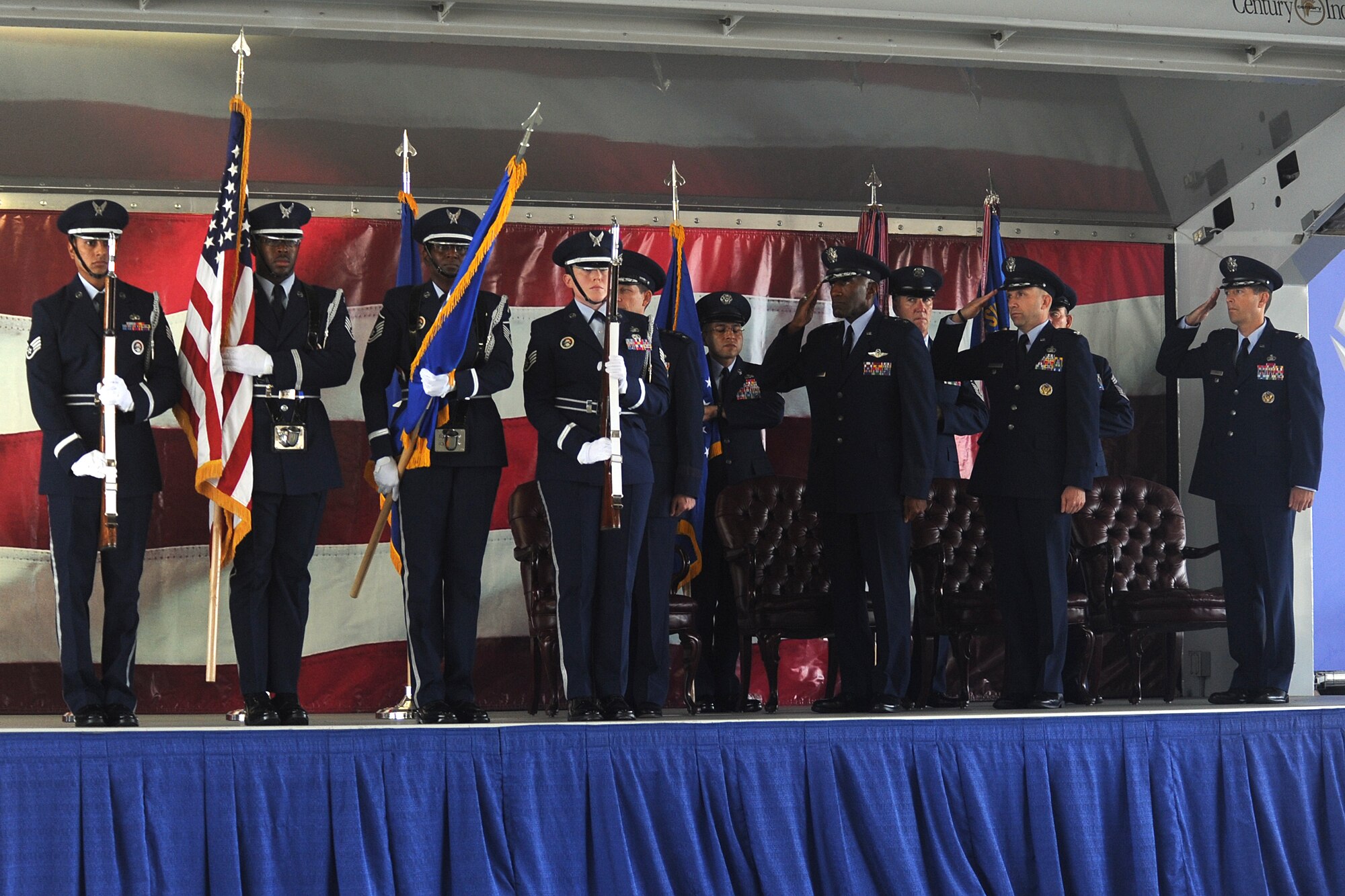 Air Force Deputy Chief of Staff for Manpower, Personnel and Services Lt. Gen. Darrell D. Jones, Air Force Personnel Center Commander Maj. Gen. A.J. Stewart, AFPC Manpower Directorate Director Col. Kent White and AFPC Services Directorate Director Col. Thomas Joyce salute the flag during the national anthem at the Air Force personnel, manpower and services inactivation and consolidation ceremony July 17 at Randolph Air Force Base. (U.S. Air Force photo/Ben Faske)