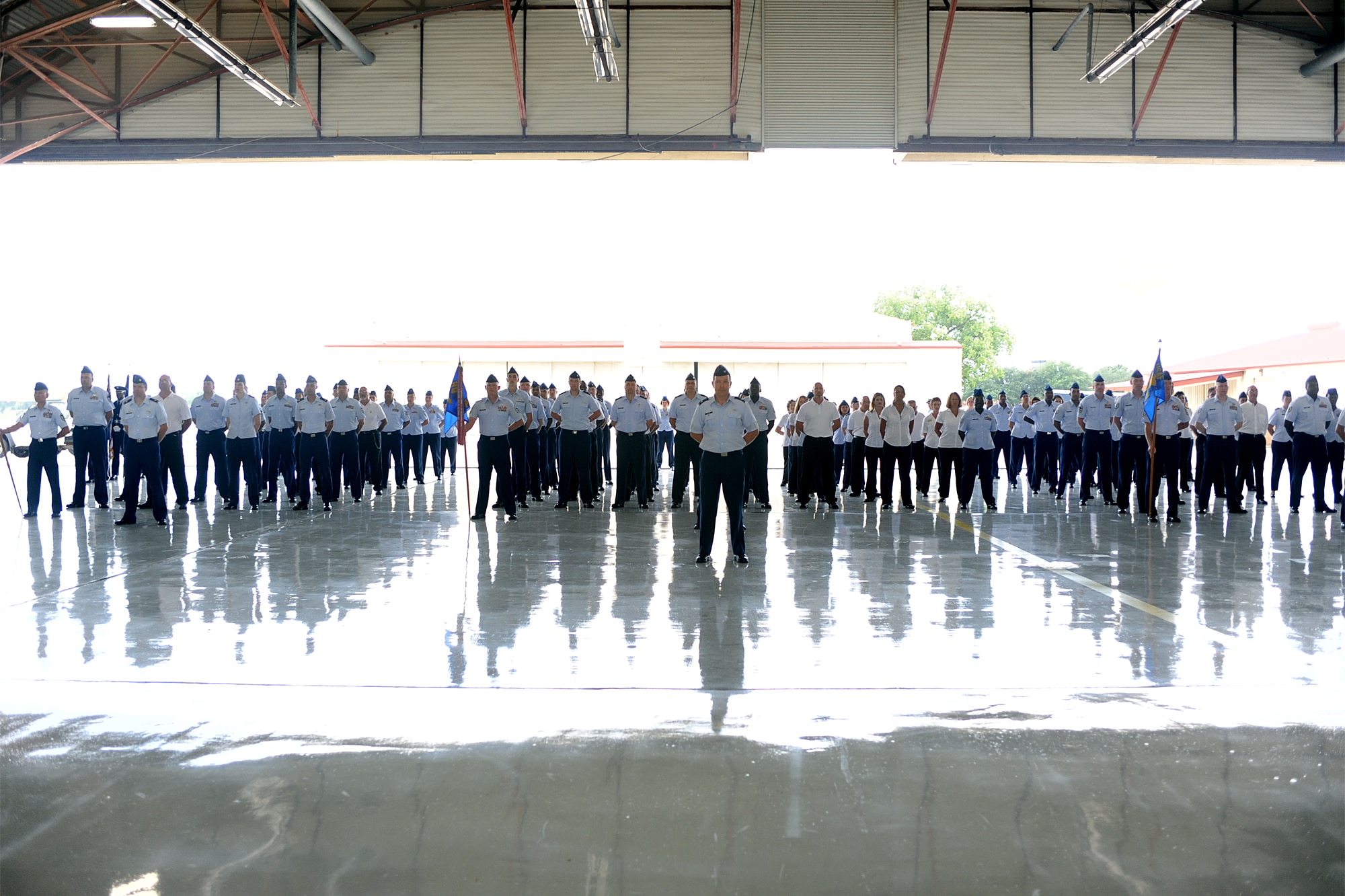 Airmen from the new Air Force Personnel Center stand in formation during the Air Force personnel, manpower and services inactivation and consolidation ceremony July 17 at Randolph Air Force Base. Air Force Deputy Chief of Staff for Manpower, Personnel and Services Lt. Gen. Darrell D. Jones inactivated the Air Force manpower and Air Force services agencies, designating them as AFPC directorates (U.S. Air Force photo/Ben Faske)