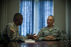Sgt. Maj. Kelly Hill, 841st Transportation Battalion sergeant major (left), briefs Chief Master Sgt. Martin Klukas, U.S. Transportation Command senior enlisted leader, Scott Air Force Base, Ill., on USTRANSCOM operations during Klukas’ visit to the 841st Transportation Battalion at Joint Base Charleston - Weapons Station, S.C., July 13, 2012. Klukas is the principal advisor to the combatant commander for all matters concerning joint force integration, career development, utilization and sustainment of more than 150,000 enlisted personnel serving USTRANSCOM's air, land and sea components throughout the world. (U.S. Air Force photo by Airman 1st Class George Goslin) 

