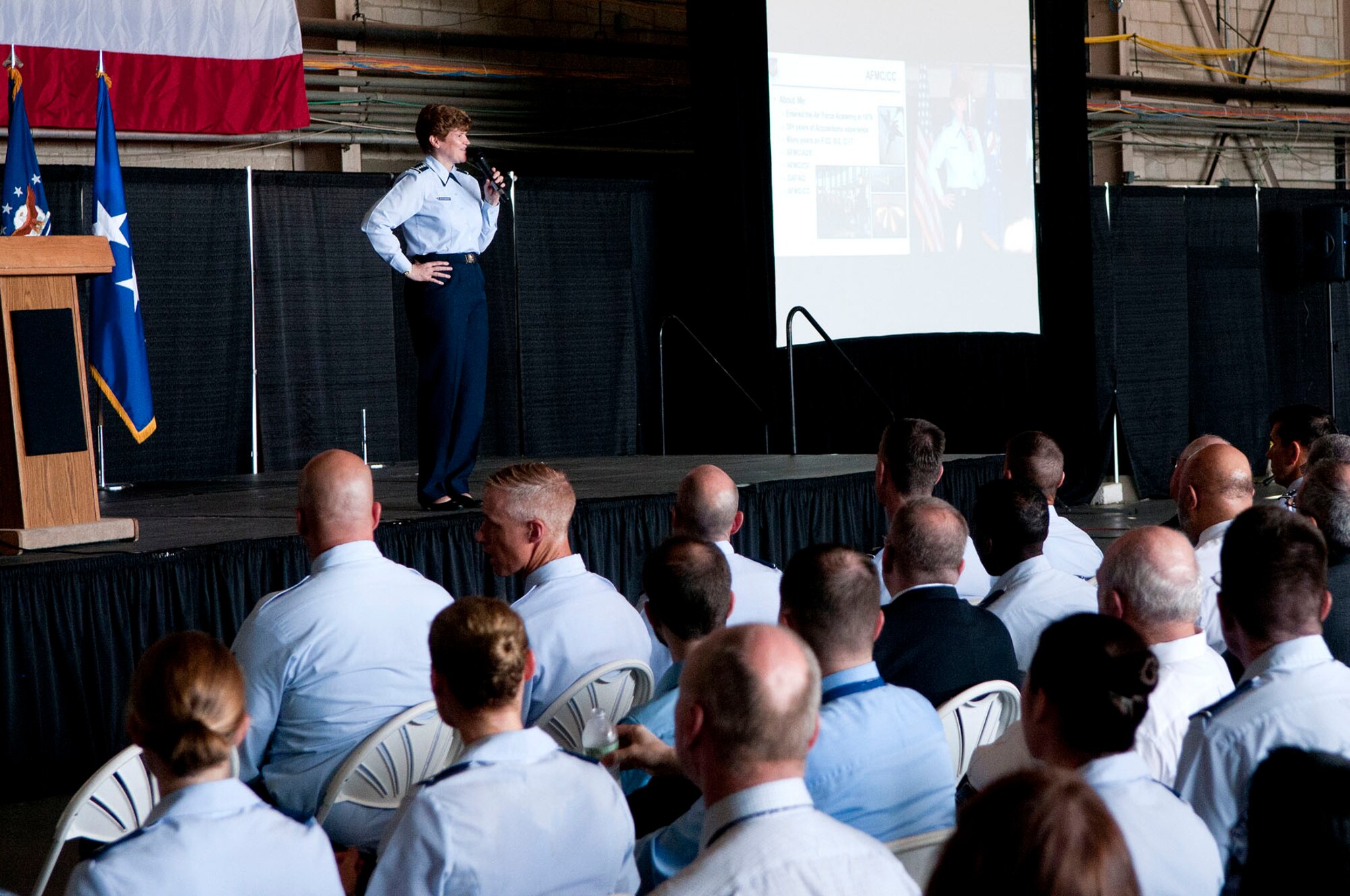 HANSCOM AIR FORCE BASE, Mass. - Gen. Janet Wolfenbarger, Air Force Materiel Command commander, speaks to the workforce here during a commander’s call July 16 at the Aero Club Hangar. Wolfenbarger, who had presided over the Electronic Systems Center Transition Ceremony earlier in the day, shared her thoughts and philosophy about leading AFMC during the call. (U.S. Air Force photo by Mark Wyatt)