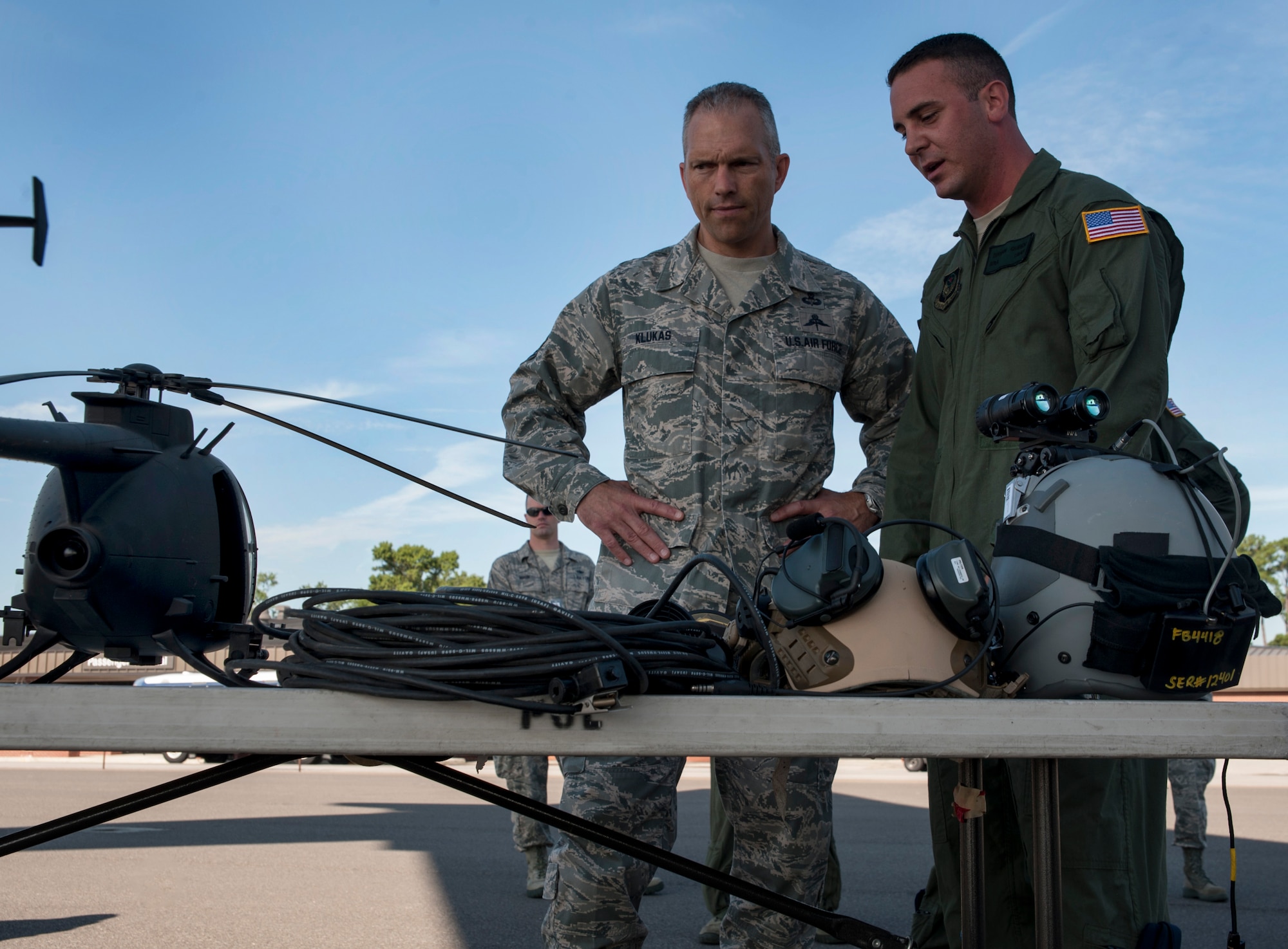 Senior Airman Bryan Queen, 628th Logistics Readiness Squadron Fuels Flight, Forward Area Refueling Point team, explains FARP operations to Chief Master Sgt. Martin Klukas, U.S. Transportation Command senior enlisted leader, from Scott Air Force Base, Ill., at Joint Base Charleston – Air Base, S.C., July 12, 2012. The FARPs mission is to hot refuel, which is to refuel while the engines are operating, from a tanker aircraft (C-17 Globemaster III) to a receiver aircraft, under the cover of darkness in an austere environment. Klukas is the principal advisor to the combatant commander for all matters concerning joint force integration, career development, utilization and sustainment of more than 150,000 enlisted personnel serving USTRANSCOM's air, land and sea components throughout the world. (U.S. Air Force photo/Airman 1st Class Ashlee Galloway)

