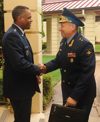 Maj. Gen. Everett Thomas, Air Force Global Strike Command vice commander, greets Gen. Lt. Anatoliy Dmitriyevick Zhikharyev, Russian Long Range Aviation and Delegation commander, outside the Eubank Conference Center on Barksdale Air Force Base, La., July 12. Zhikharyev and members of his staff visited various units on Barksdale as part of a site survey for a bomber exchange program. Ultimately, the Russian Air Force will send a bomber to Barksdale, and the 2nd Bomb wing will send a B-52H Stratofortress to Russia, enabling the two nations to share information about their operational capabilities. (U.S. Air Force photo/Senior Airman Sean Martin)(RELEASED)