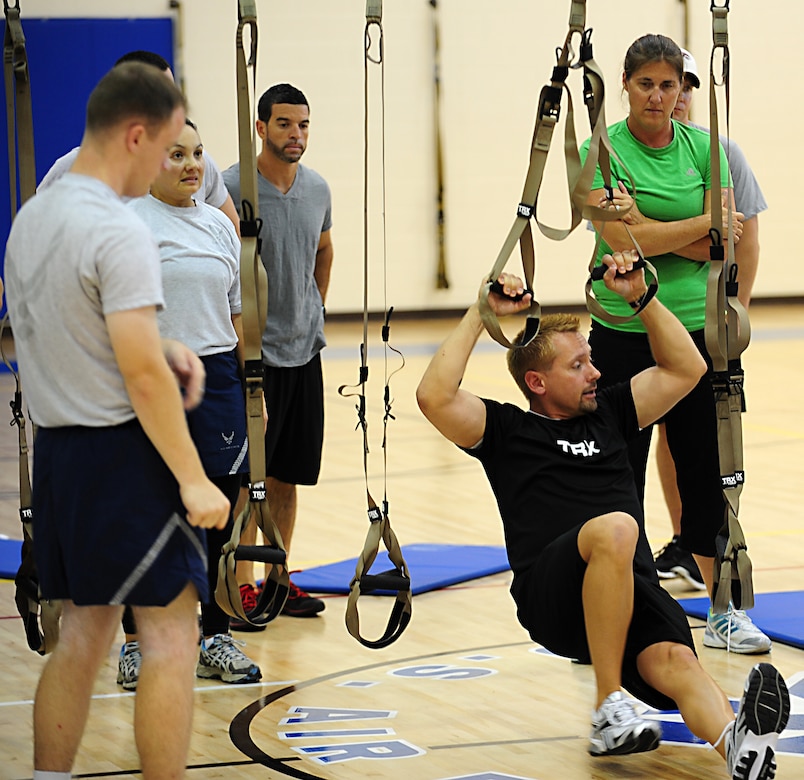 Mike Skaggs, Total Resistance Exercise instructor, demonstrates an exercise at Langley Air Force Base, Va., Shellbank Fitness Center, July 11, 2012.  TRX is a full-body strength and cardio exercise developed for service members by Service members in the U.S. Navy special forces.  (U.S. Air Force photo by Airman 1st Class Kayla Newman/Released)