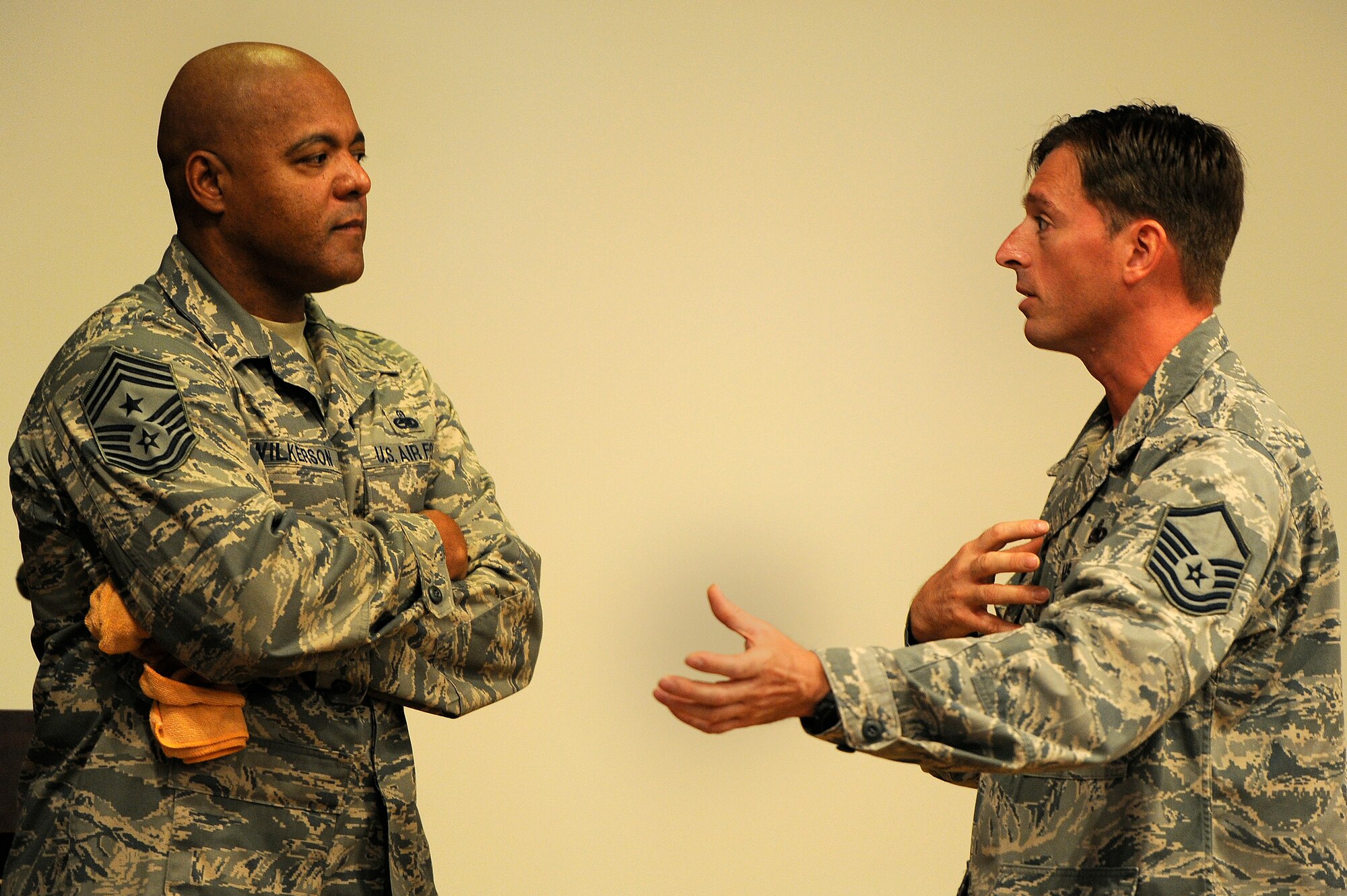 U.S. Air Force Chief Master Sgt. James Wilkerson, 20th Fighter Wing command chief, speaks to a Master Sgt. after an enlisted all call, July 13, 2012, Shaw Air Force Base, S.C. Wilkerson conducted one on one conversations to address Airmen’s concerns after an enlisted all call held to present the senior enlisted perspective of the 20th FW Commander’s message. (U.S. Air Force photo by Senior Airman Kenny Holston/Released) 