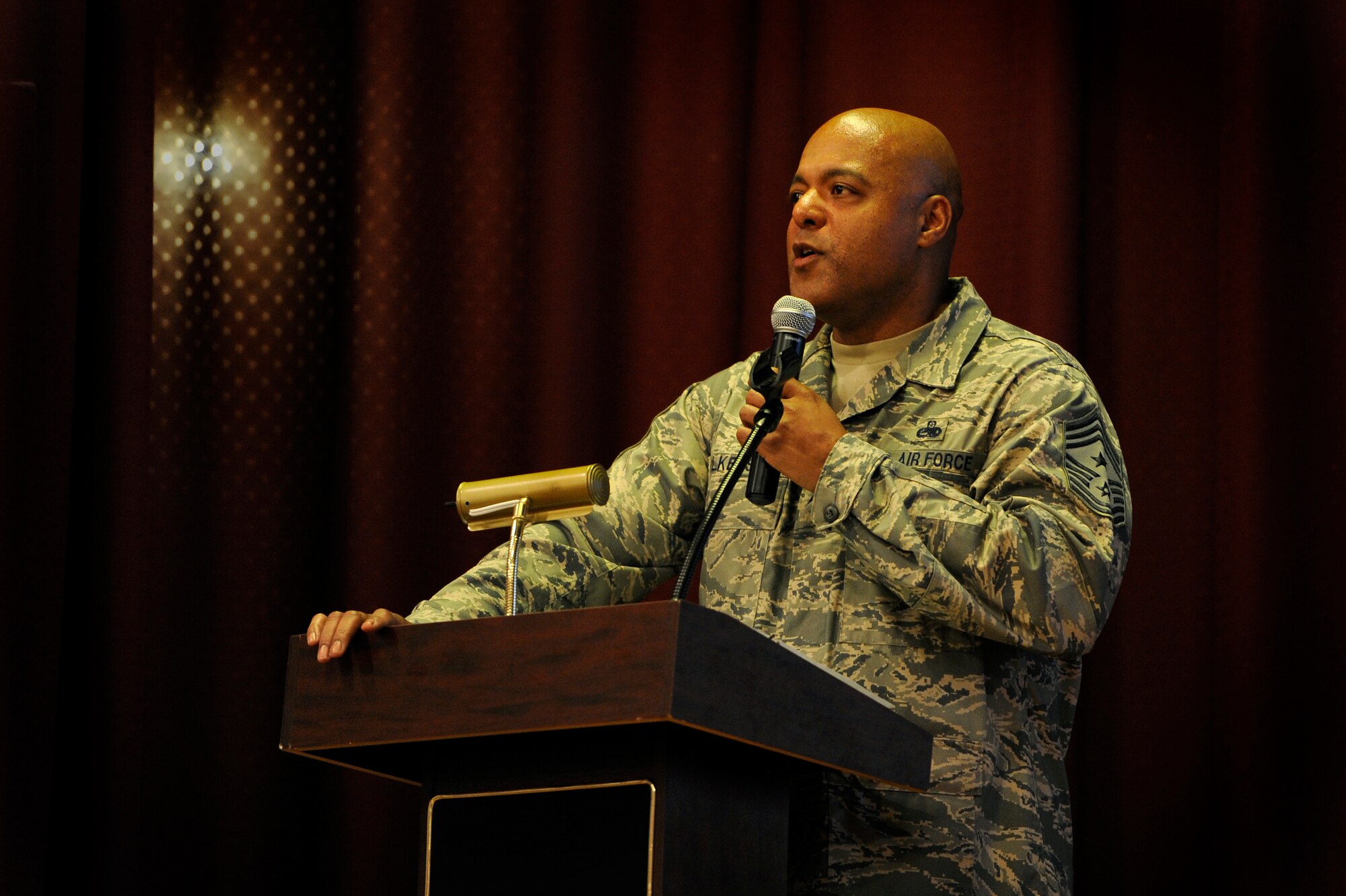 U.S. Air Force Chief Master Sgt. James Wilkerson, 20th Fighter Wing command chief, speaks to Team Shaw Airmen during an enlisted all call, July 13, 2012, Shaw Air Force Base, S.C. Wilkerson held the enlisted all call to present the senior enlisted perspective of the 20th FW Commander’s message and intent while soliciting feedback and directly answering questions from the Airmen. (U.S. Air Force photo by Senior Airman Kenny Holston/Released) 