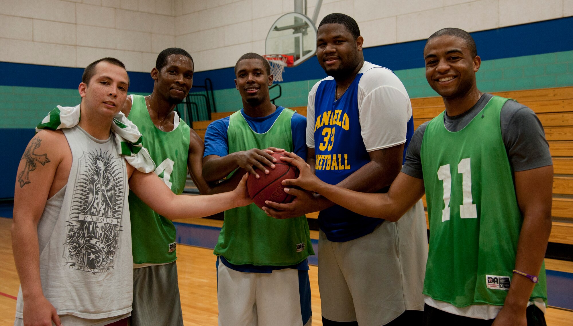 GOODFELLOW AIR FORCE BASE, Texas - Members of ‘Team 1’ celebrate their victory in the "Bring the Rock" basketball tournament at the Mathis Fitness Center July 14. The 5-on-5 player, free tournament was presented by Taylor Chapel and the 17th Force Support Squadron. Although ‘Team 1’ was the ultimate winning group in the tournament, each team had just as much fun playing basketball. (U.S.Air Force Photo/ Airman 1st Class Erica Flores) 

