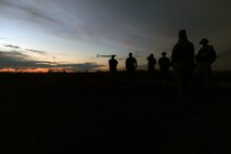 GARRISON, N.D. -- Aircrew members from the 23rd Bomb Squadron and the 54th Helicopter Squadron participating in the combat skills training take a break here, July 11. The course went over basic survival skills including: wilderness living, shelter construction, fire building, map and compass navigation, backpacking, food and water procurement, wilderness medicine and first aid, signaling and rescue techniques and escape and evasion. (U.S. Air Force photo/Senior Airman Brittany Y. Auld)