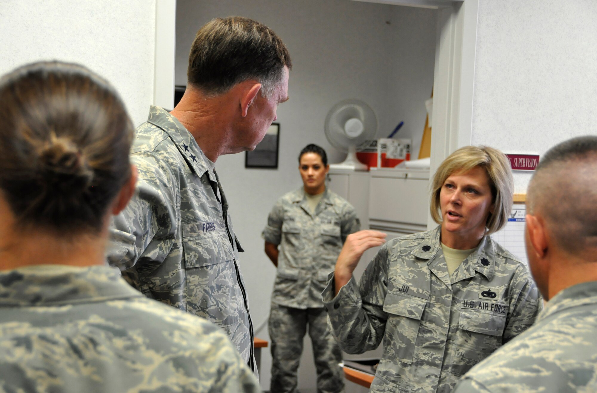 Air Force Reserve Lt. Col. Lynn Jui, 302nd Logistics Readiness Squadron commander, explains to Maj. Gen. Wallace W. “Wade” Farris, Jr., some of the results associated with the squadron recently moving to a privatized transportation service July 15 at Peterson Air Force Base, Colo. Farris, who commands the 22nd Air Force, the parent organization to the 302nd Airlift Wing, visited the wing to see its mission firsthand as well as gain a better understanding of its involvement with the recent Modular Airborne Fire Fighting System, or "MAFFS" activation to battle the nearby Waldo Canyon Fire. The general also coined a number of Air Force Reservists who had gone above and beyond in their respective 302nd AW positions. Farris visited the wing July 14-17. Peterson AFB is located in Colorado Springs, Colo. (U.S. Air Force photo/Staff Sgt. Stephen J. Collier)